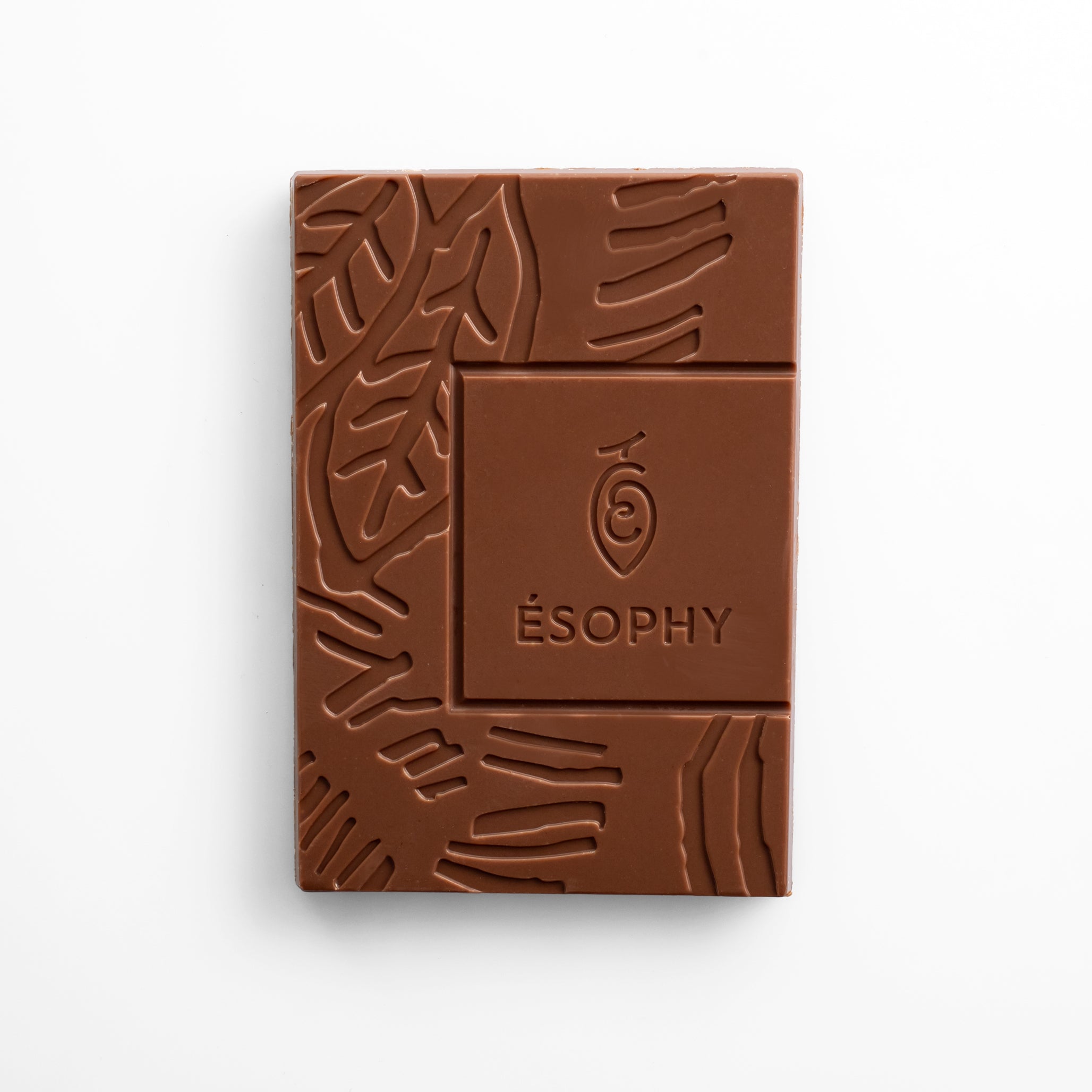 Unwrapped ÉSOPHY milk chocolate bar with embossed design and caramelized salted almonds