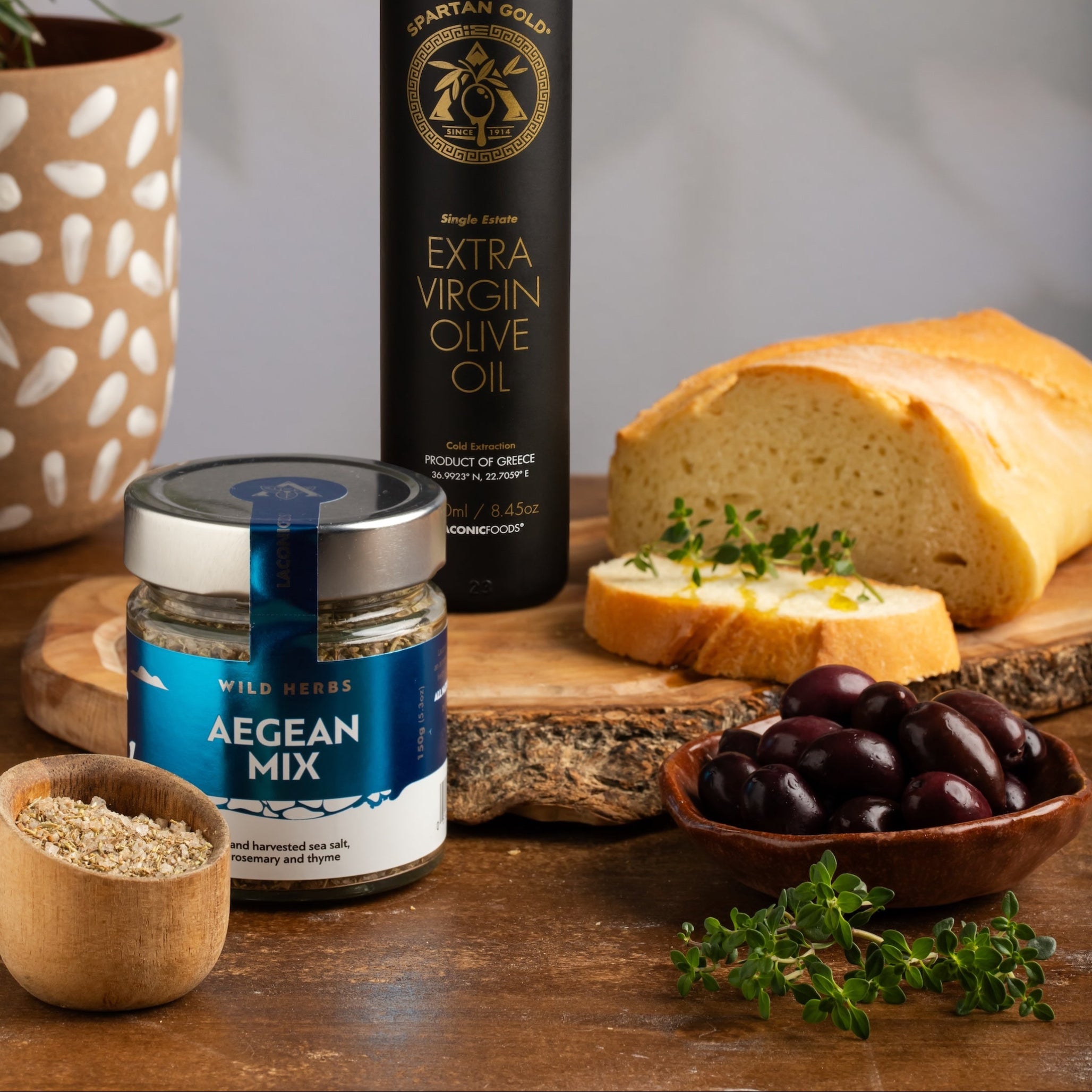 Greek Olive Oil and Aegean Mix Spice Bundle with Fresh Bread and Olives