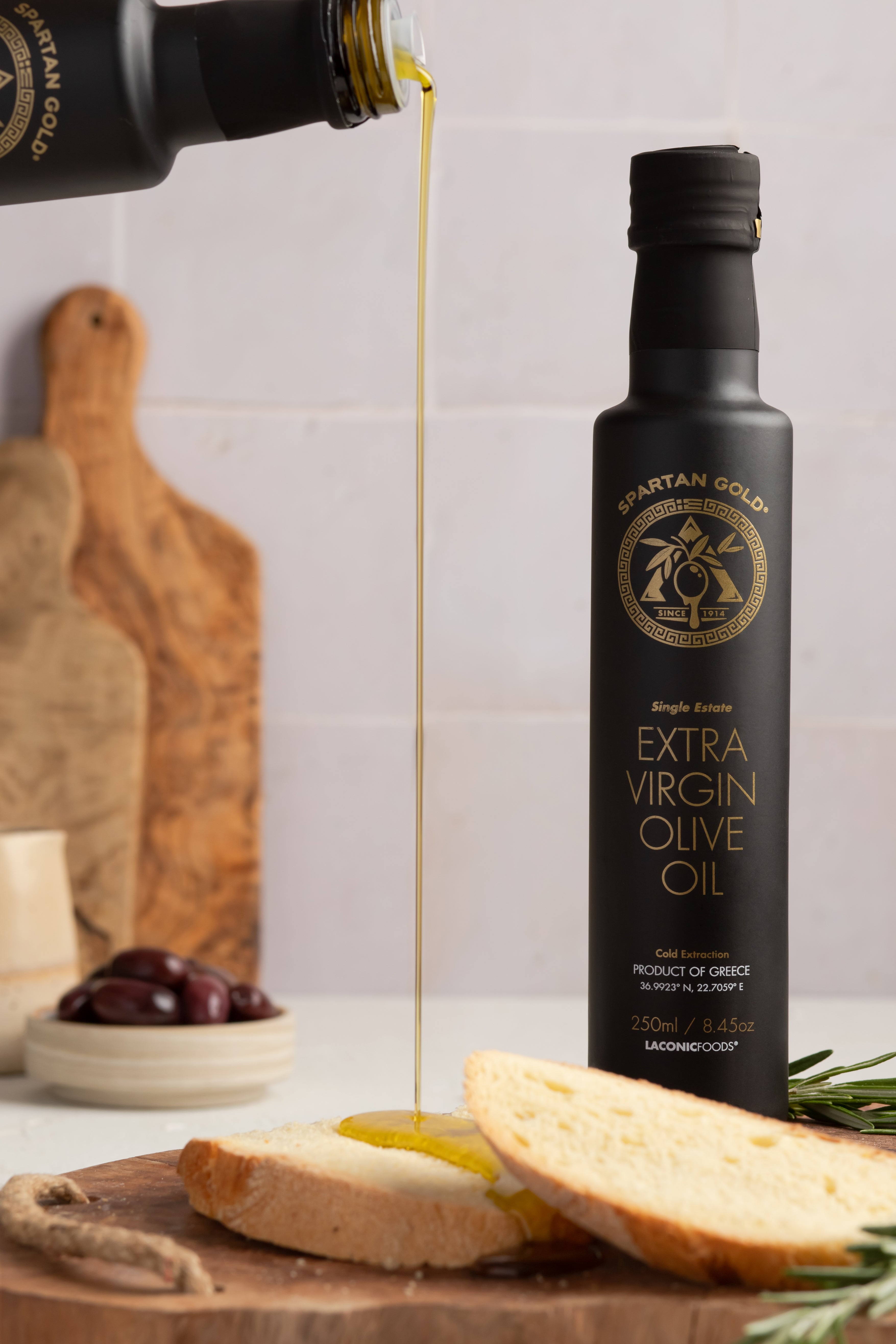 Extra Virgin Olive Oil being poured on bread – rich and golden color