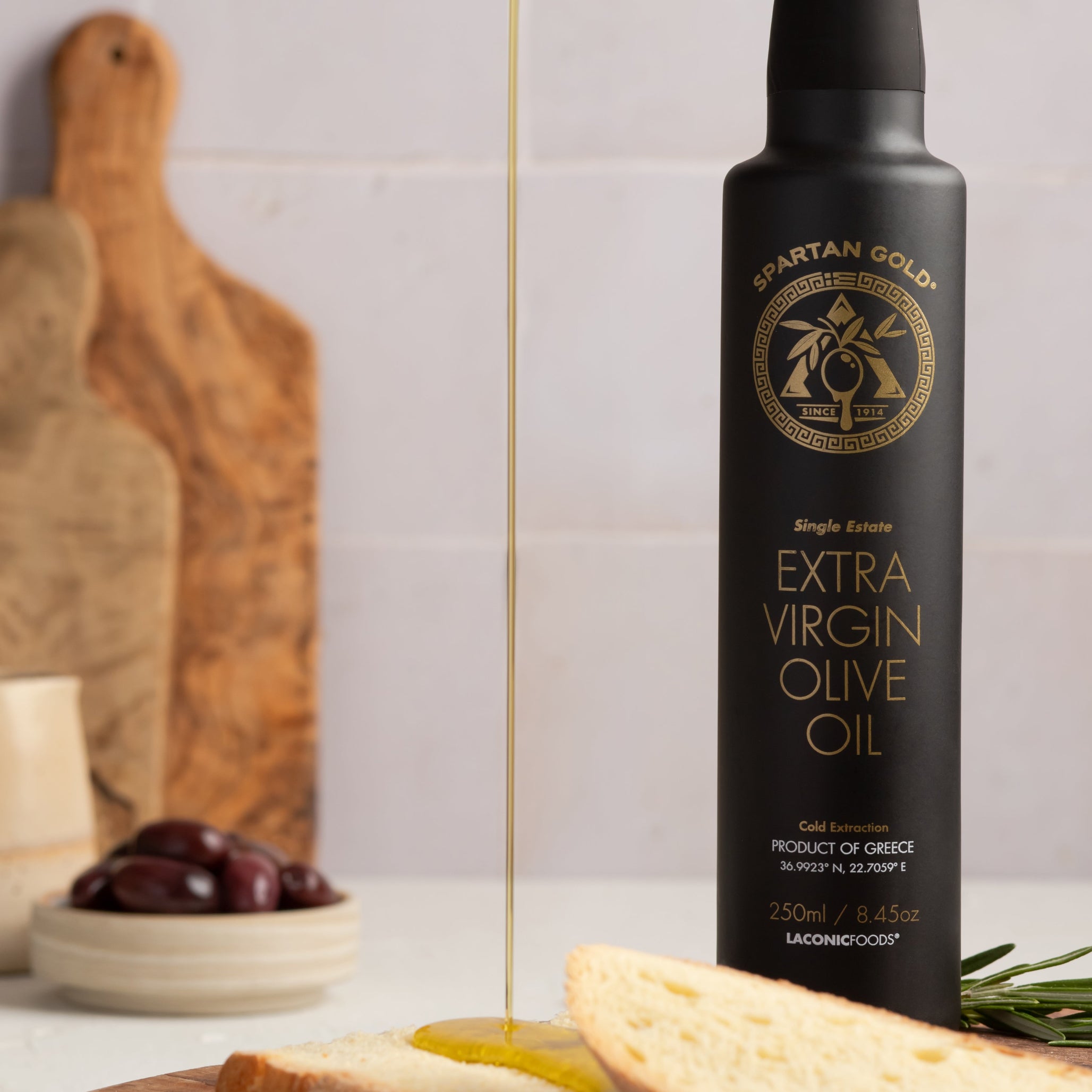 Extra Virgin Olive Oil being poured on bread – rich and golden color