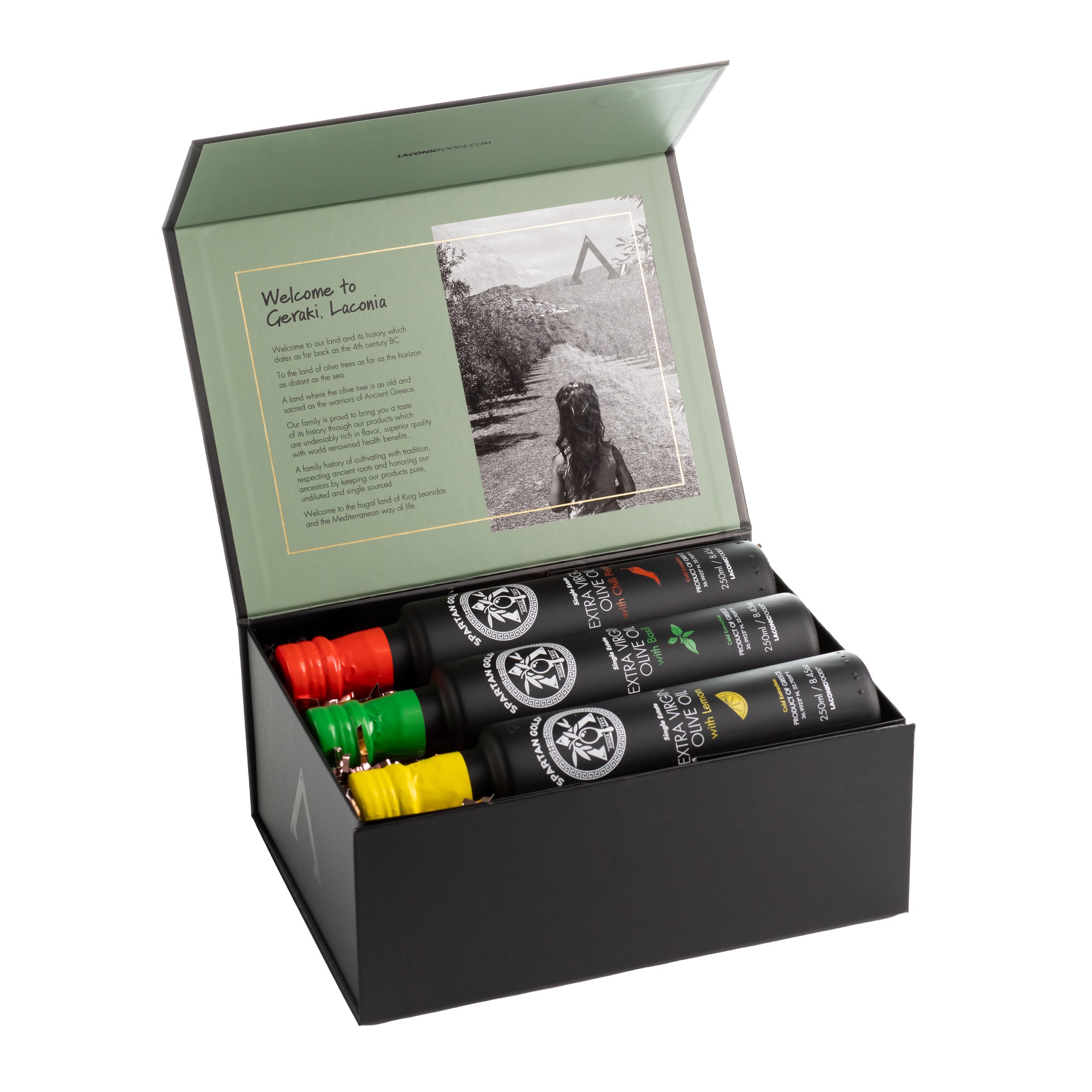 Laconic Foods Infused Olive Oil Trio Gift Box opened to reveal Basil, Chili, and Lemon bottles with welcome card.