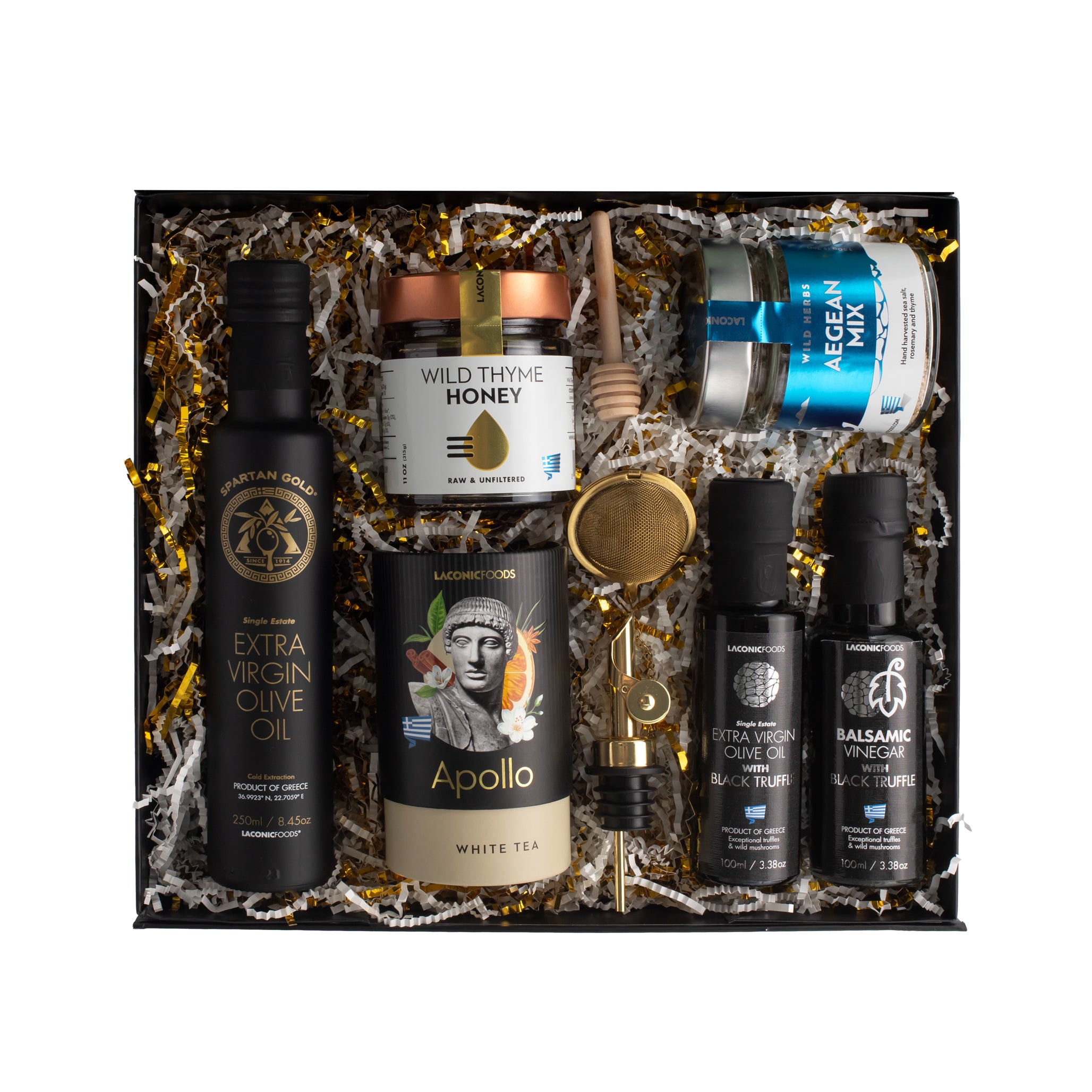 Top view of Laconic Foods Gourmet Experience Gift Box featuring extra virgin olive oil, black truffle products, Greek honey, Aegean spice mix, tea, and accessories.