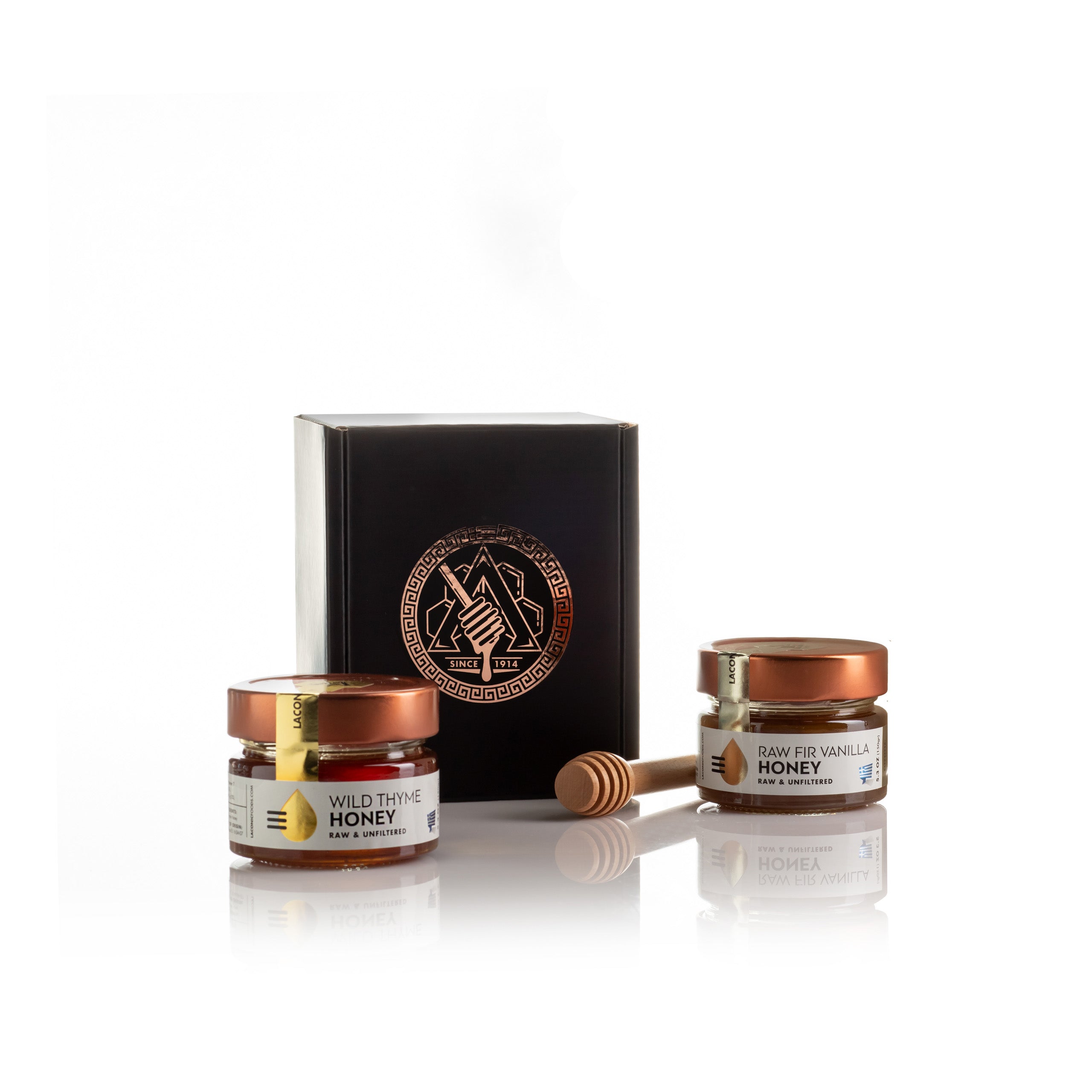 Laconic Foods Greek Honey 2-Pack Gift Set – Wild Thyme Honey and Raw Fir Vanilla Honey jars with gift box and wooden dipper.