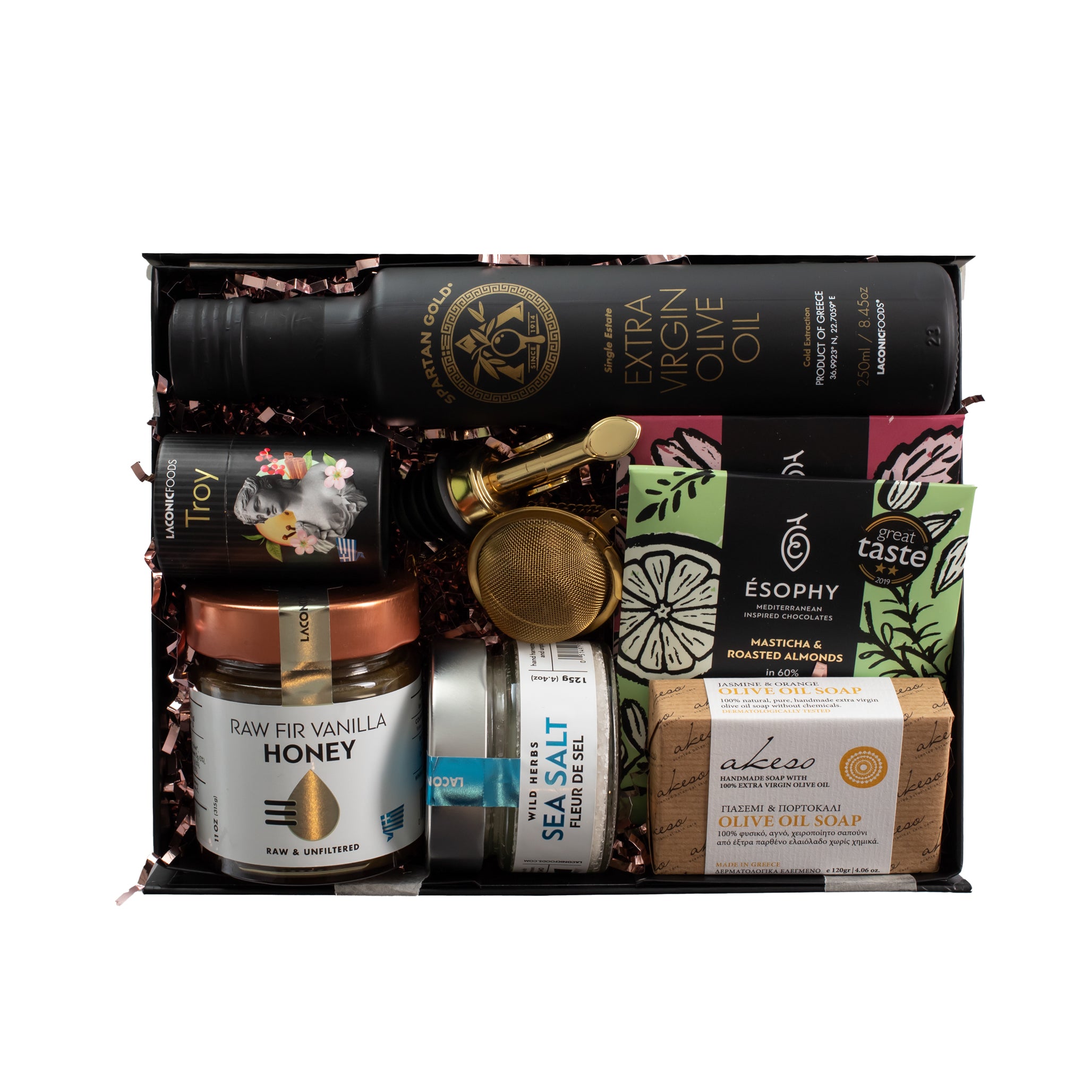 Top view of Laconic Foods Greek gift box with extra virgin olive oil, raw honey, handmade chocolates, fleur de sel, tea, soap, pourer, and infuser