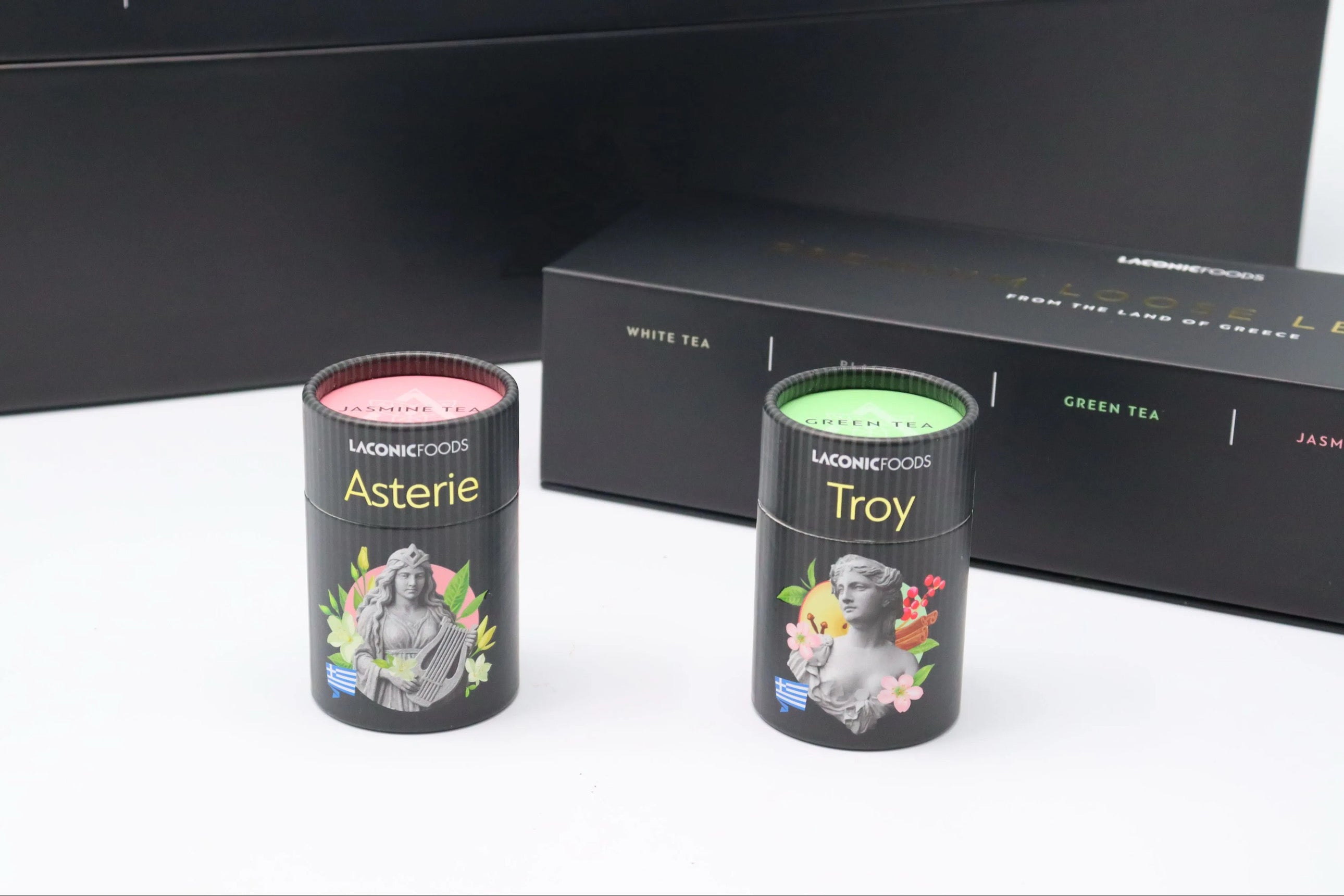 Laconic Foods Asterie and Troy loose leaf teas with tea leaves spilling from canister