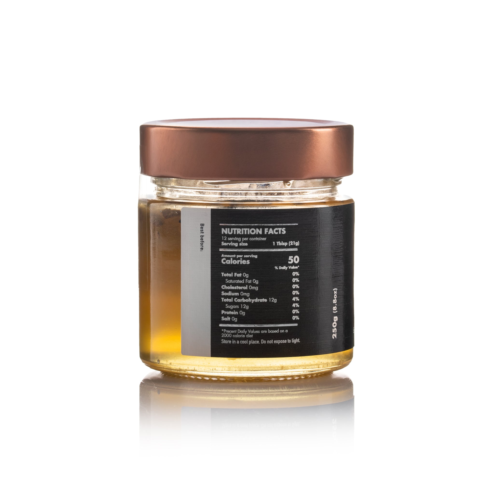 Side view of Laconic Foods Honey with Black Truffle 250g jar – nutrition facts label and golden honey reflection visible on white surface.