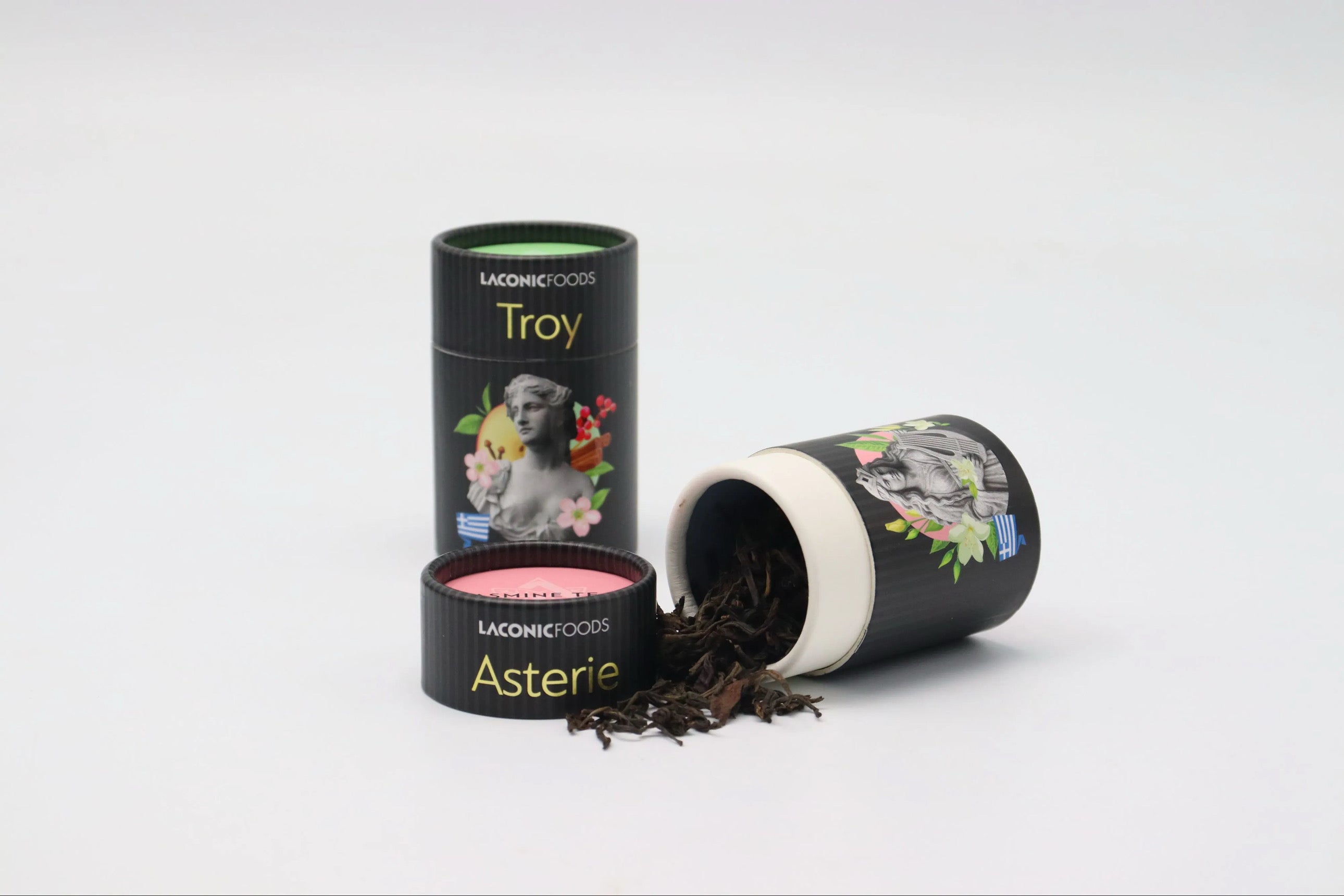 Laconic Foods Asterie and Troy loose leaf teas with tea leaves spilling from canister