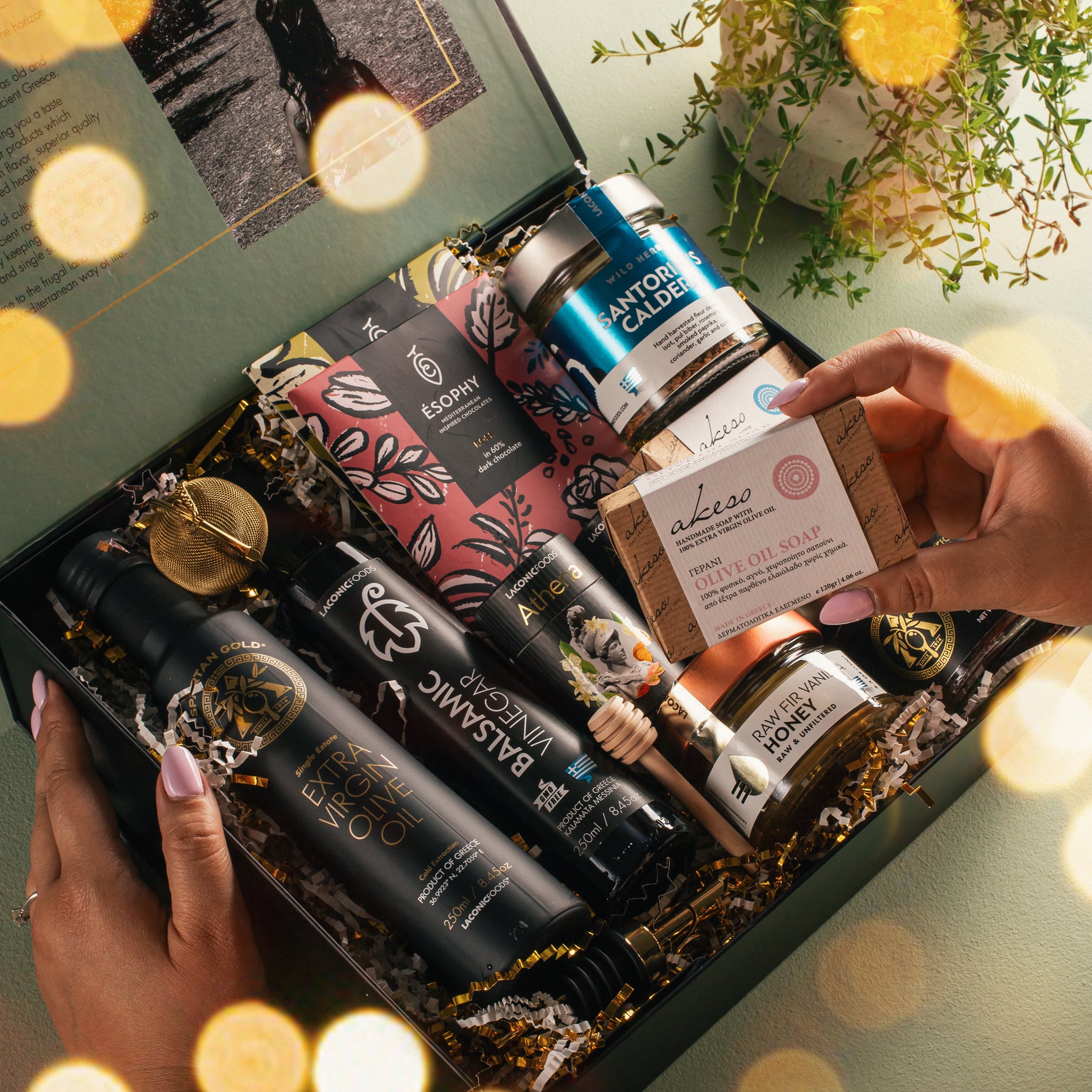 Laconic Foods luxury Greek gift box with extra virgin olive oil, balsamic vinegar, raw fir vanilla honey, olive oil soap, sea salt, tea, and gourmet accessories.