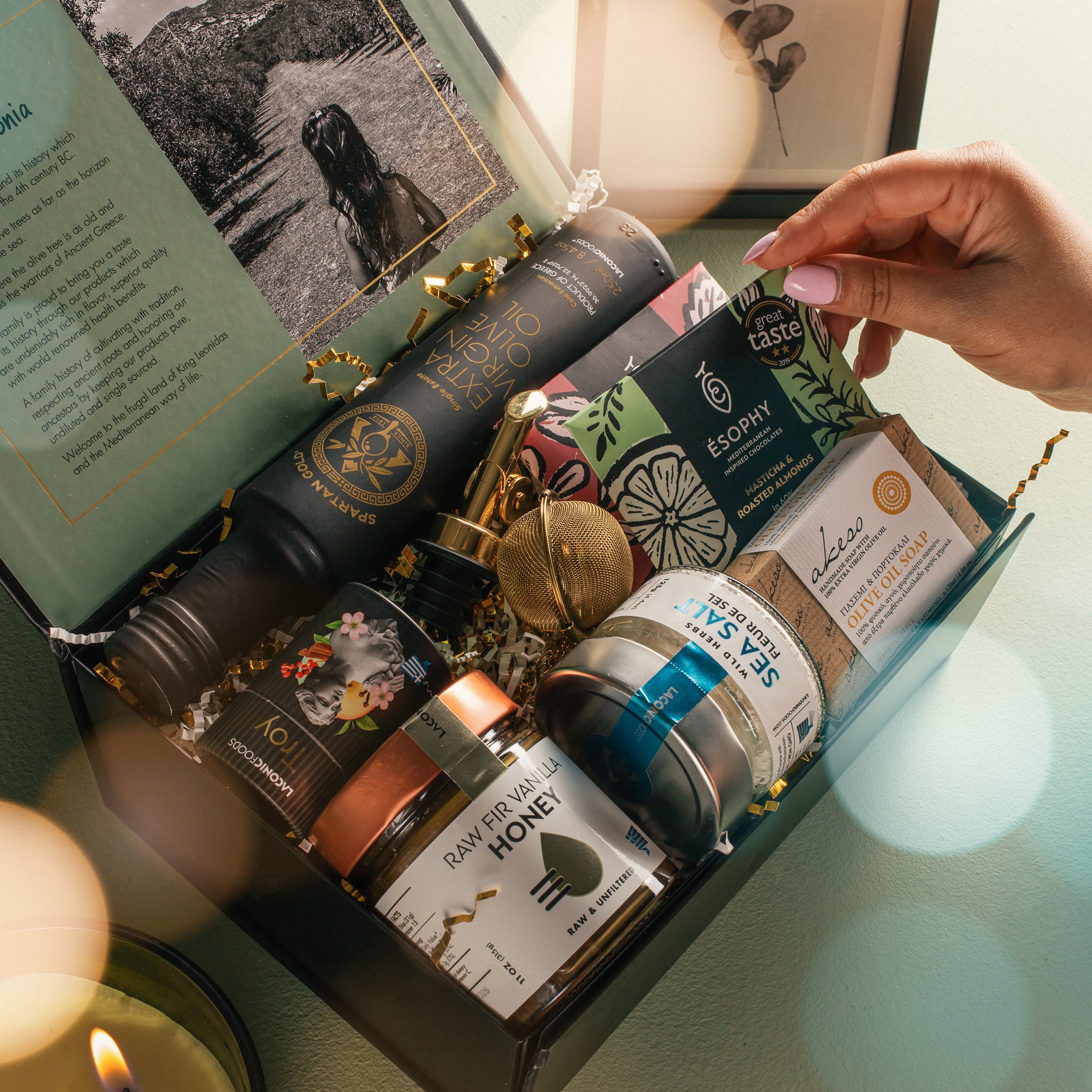 Laconic Foods premium Greek gift box with extra virgin olive oil, raw fir vanilla honey, sea salt, olive oil soap, tea infuser, and Greek chocolates.
