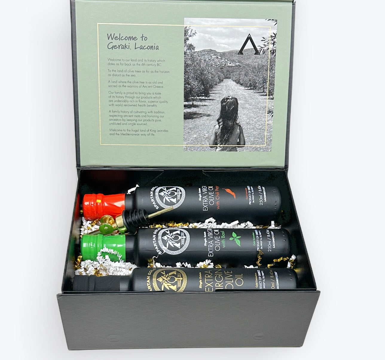 Laconic Foods Gift Box with Basil, Chili, and Extra Virgin Olive Oil bottles arranged inside.