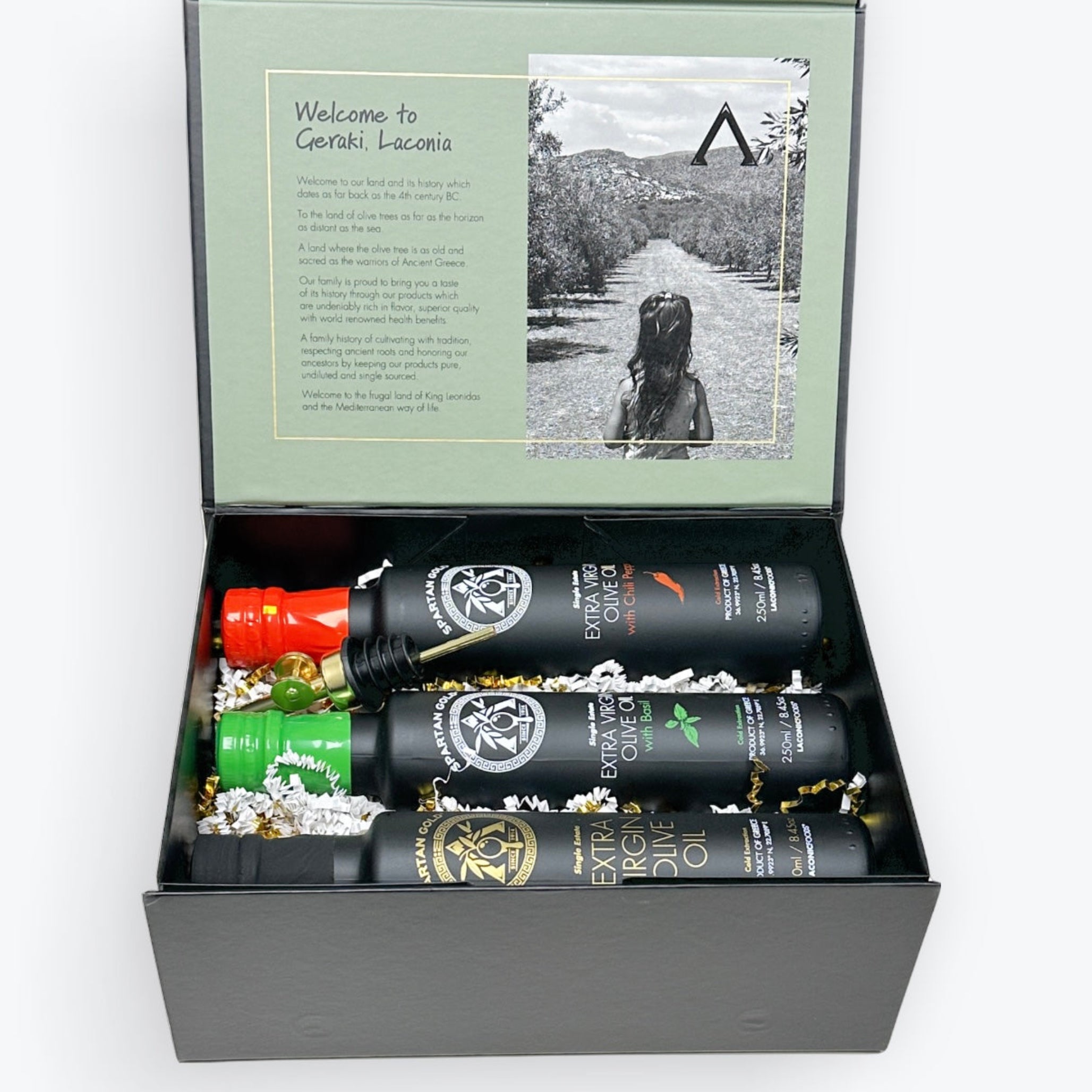 Laconic Foods Gift Box with Basil, Chili, and Extra Virgin Olive Oil bottles arranged inside.