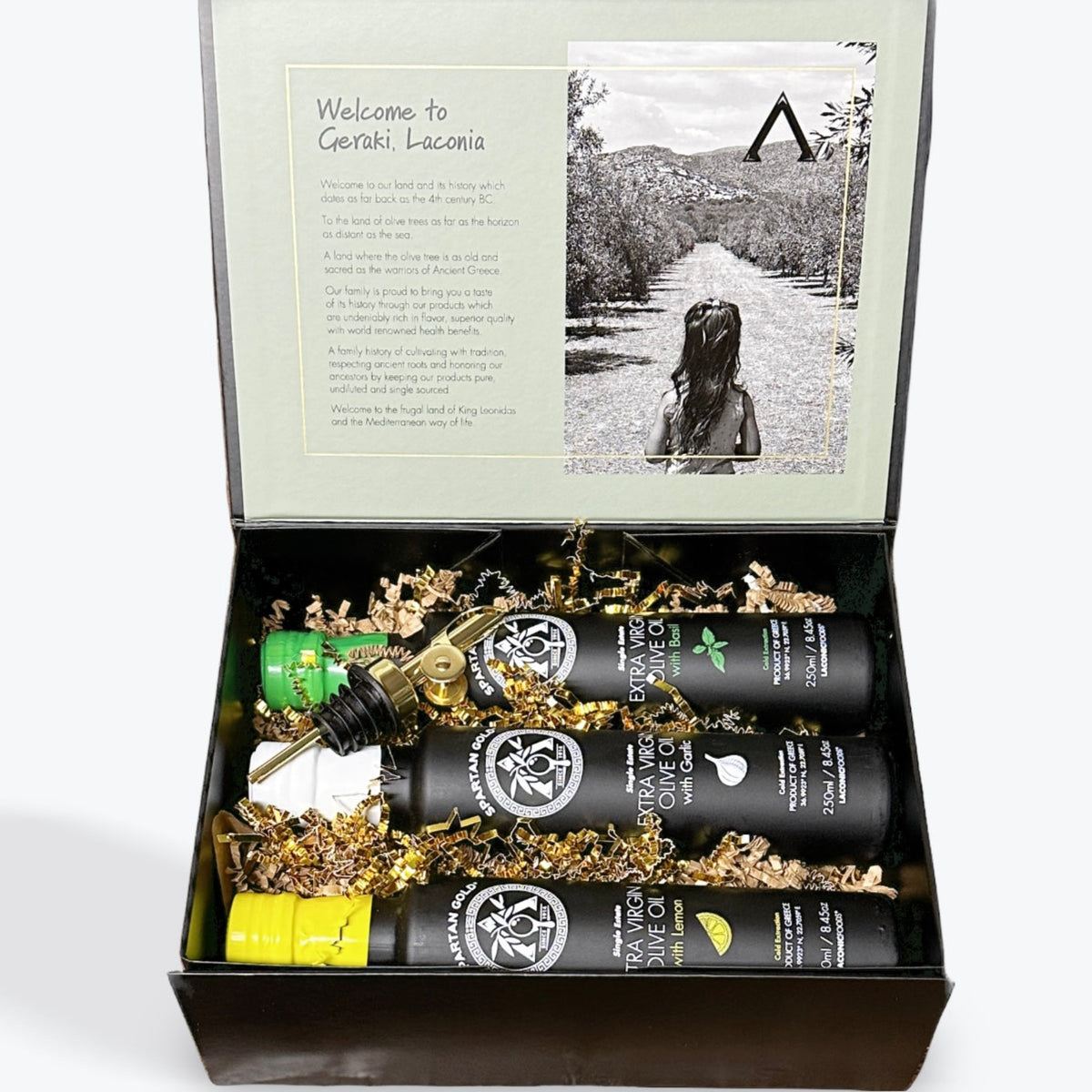 Laconic Foods Gift Box with Basil, Garlic, and Lemon infused extra virgin olive oils in open packaging.