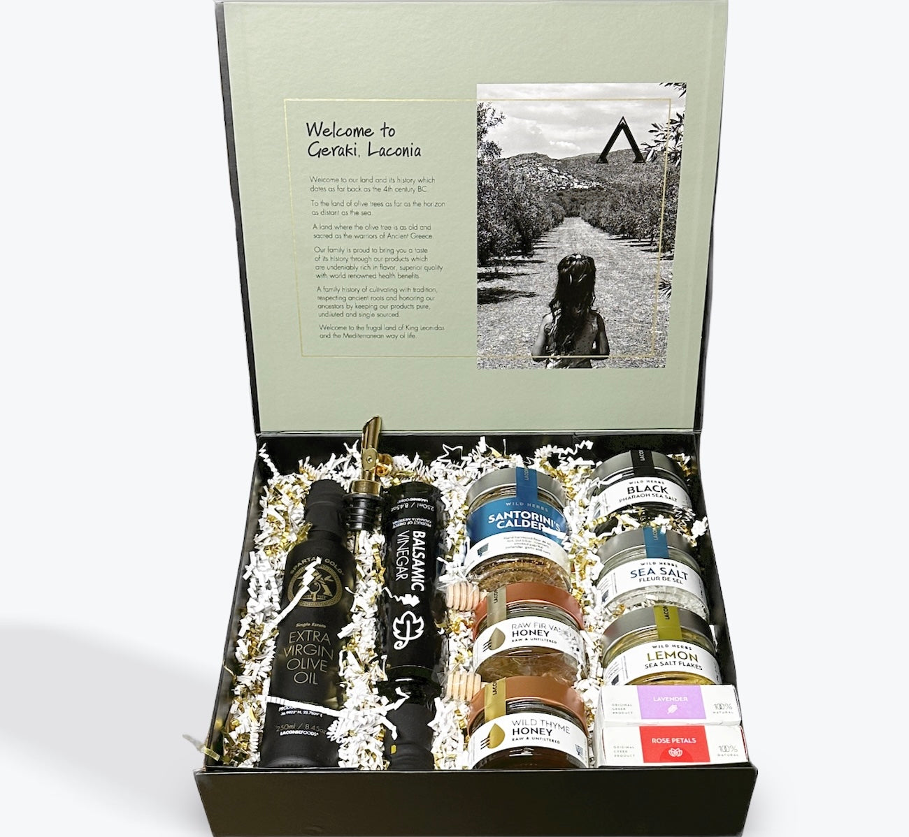 Luxury Greek Gift Box open with olive oil, balsamic vinegar, raw honey, sea salts, soap bars, and spice mix from Laconic Foods