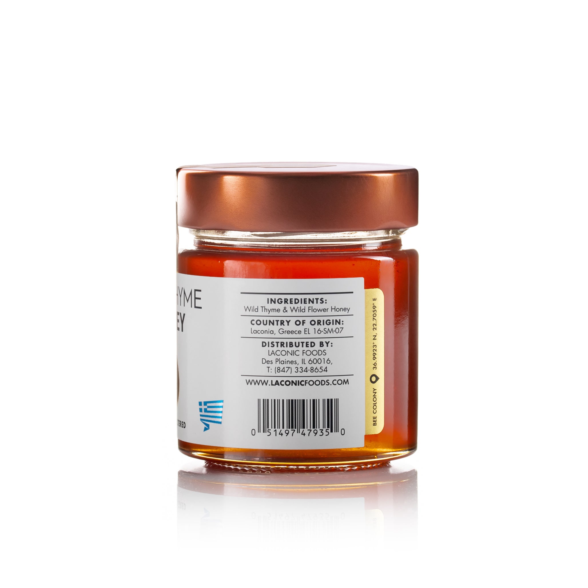 Back view of Laconic Foods Wild Thyme Honey jar showing ingredients, origin from Laconia Greece, and distributor information.