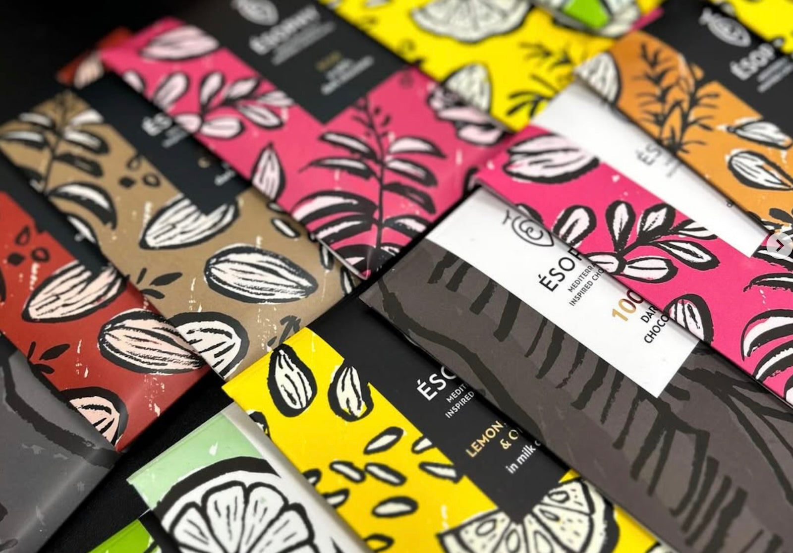 Assorted ÉSOPHY handmade Mediterranean chocolate bars in colorful packaging with Greek-inspired flavors
