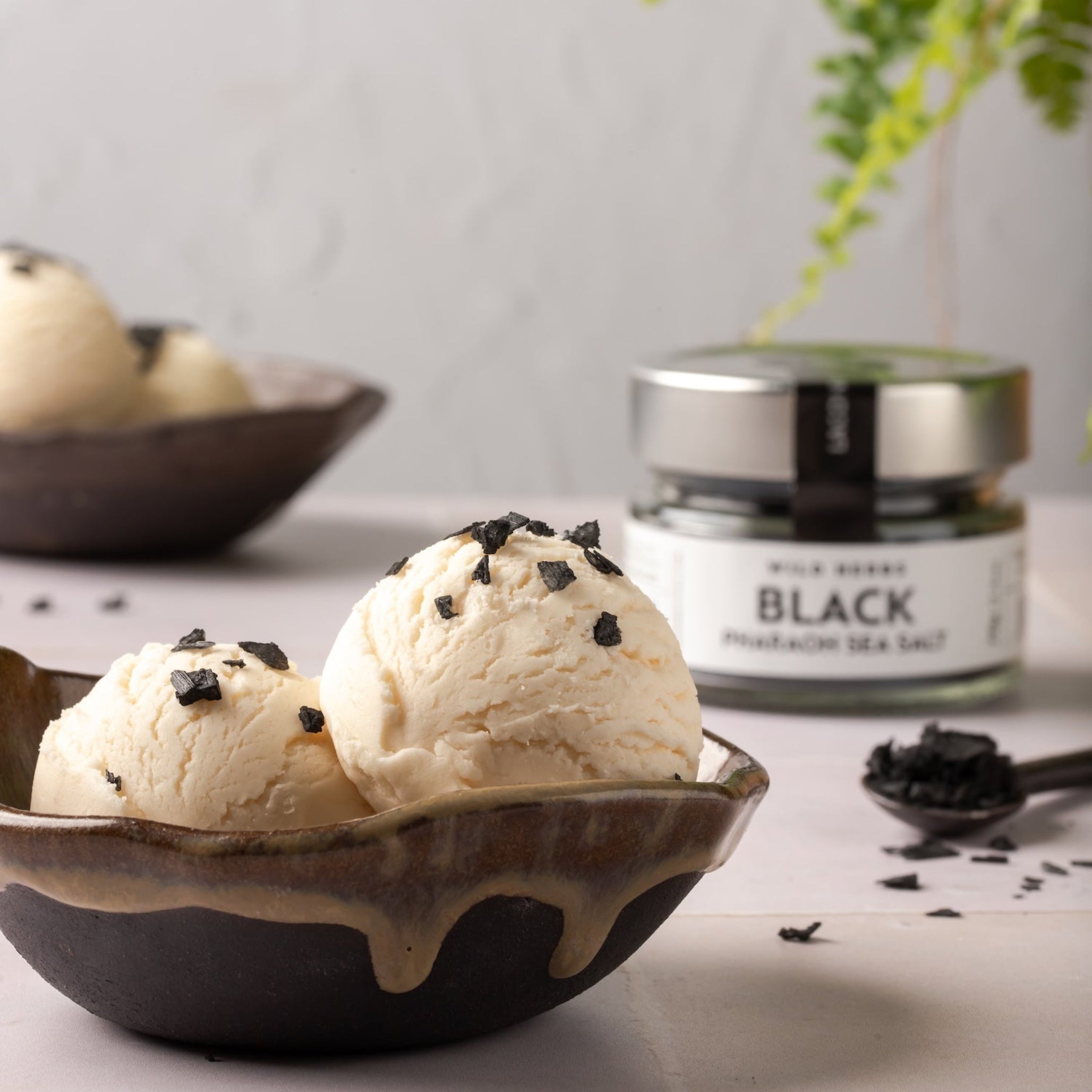 Black Pharaoh Sea Salt flakes from Laconic Foods sprinkled on vanilla ice cream for gourmet dessert