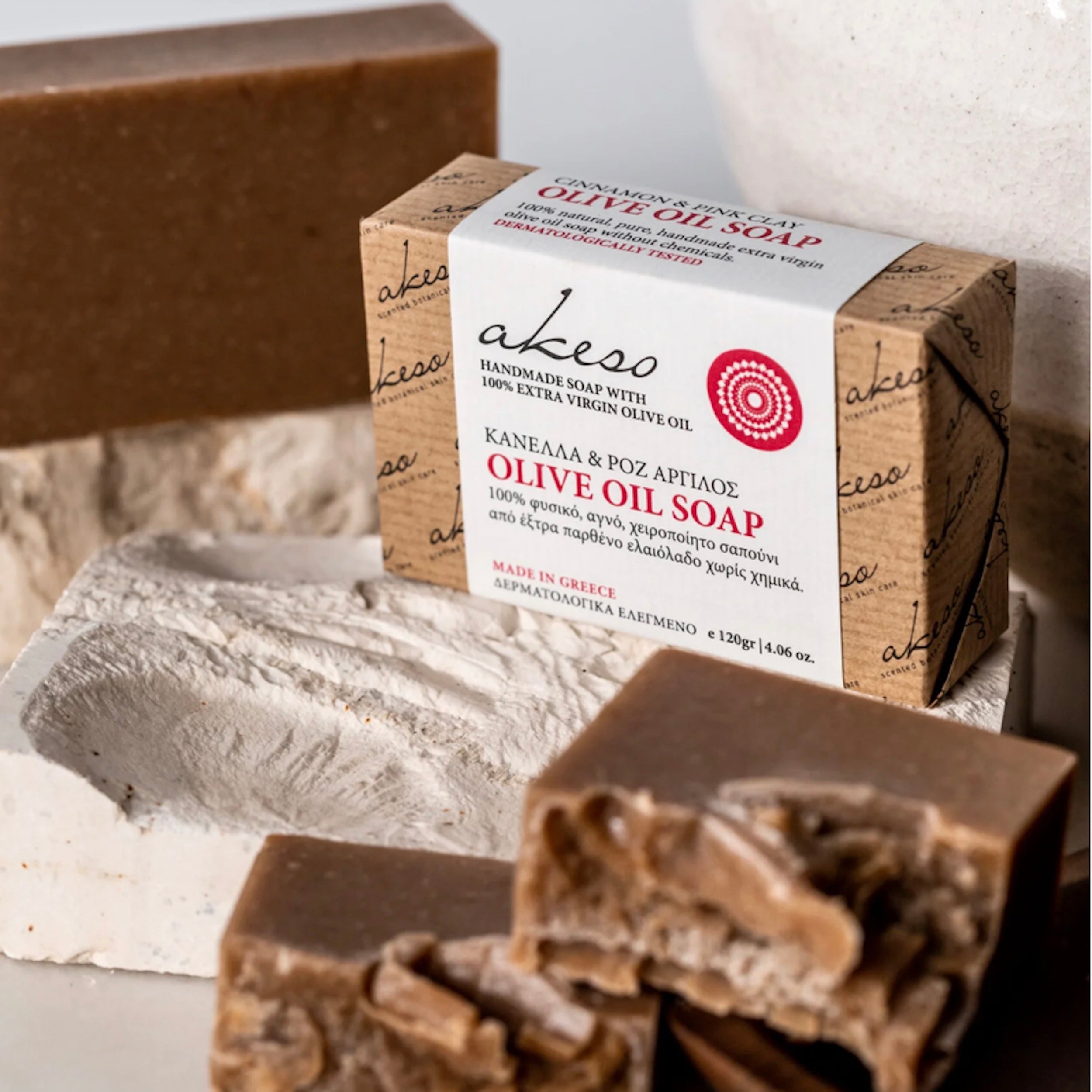 Greek Cinnamon and Pink Clay Olive Oil Soap handmade with Laconic Foods extra virgin olive oil displayed with artisan packaging, soap bars, and cinnamon sticks
