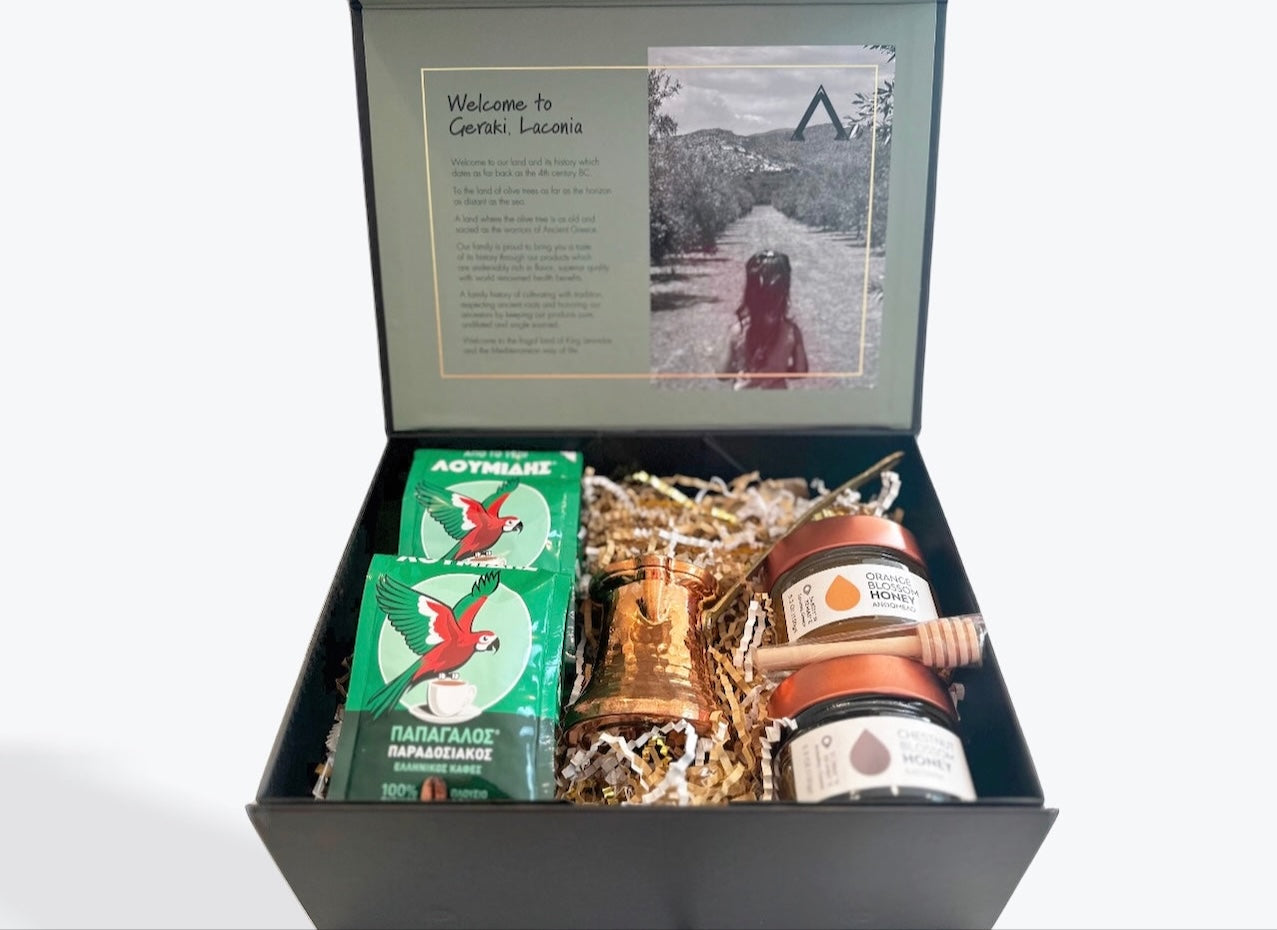 Greek coffee and honey gift set with Loumides coffee packs, copper briki, Orange Blossom honey, and Chestnut Blossom honey in a black box