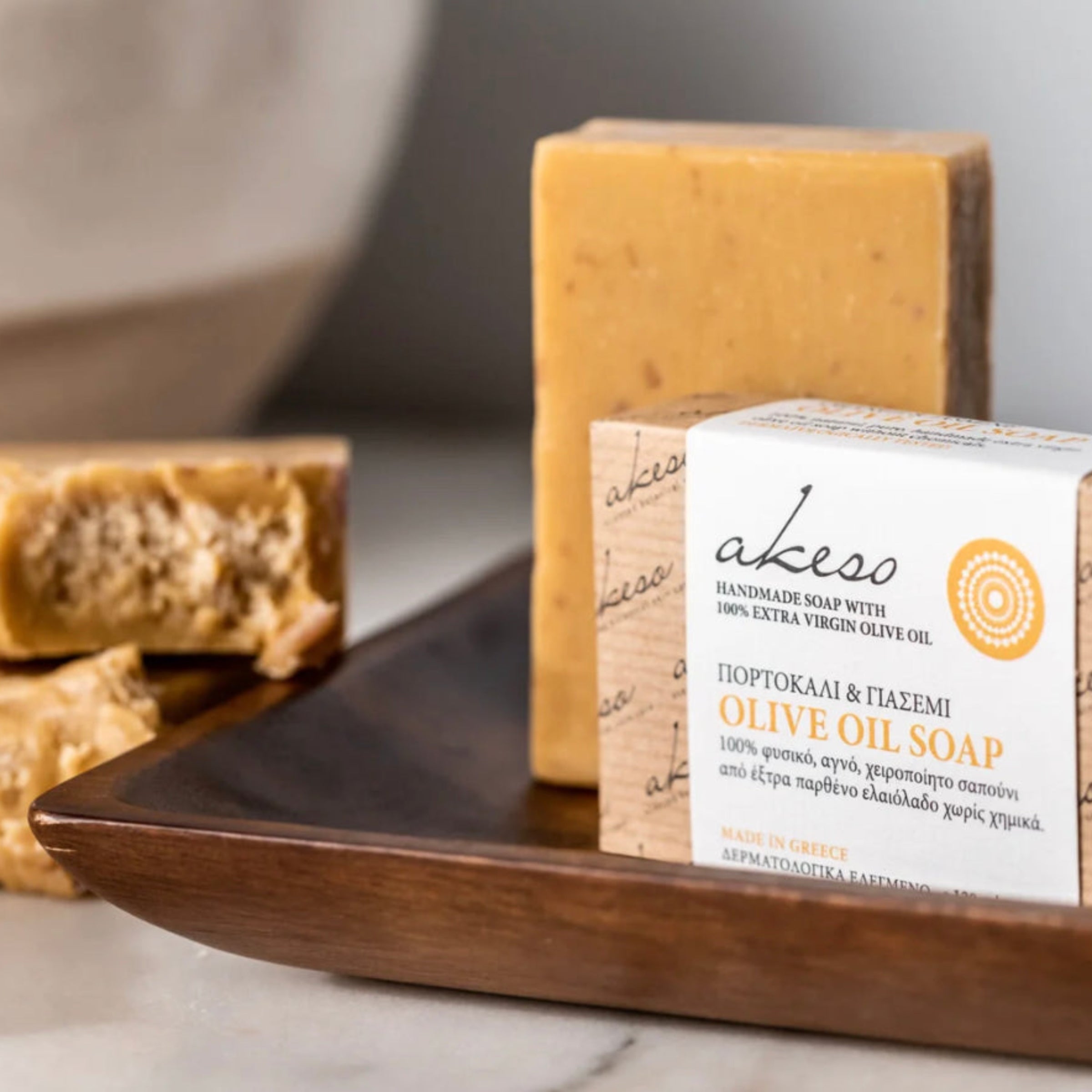 Greek Jasmine and Orange Olive Oil Soap handmade with Laconic Foods extra virgin olive oil displayed with artisan packaging and soap bars on a wooden tray
