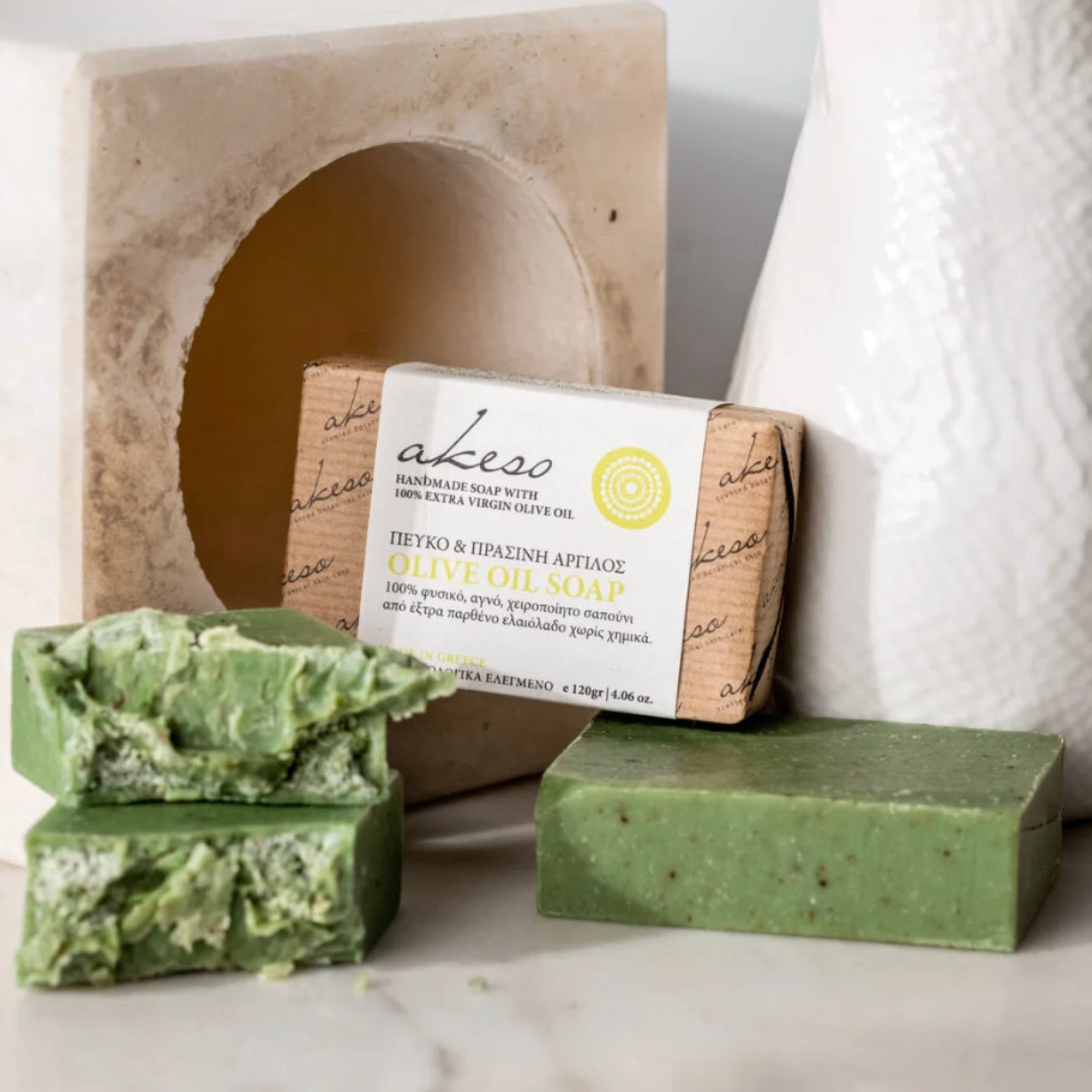 Greek Pine and Green Clay Olive Oil Soap handmade with Laconic Foods extra virgin olive oil displayed with artisan packaging and green soap bars