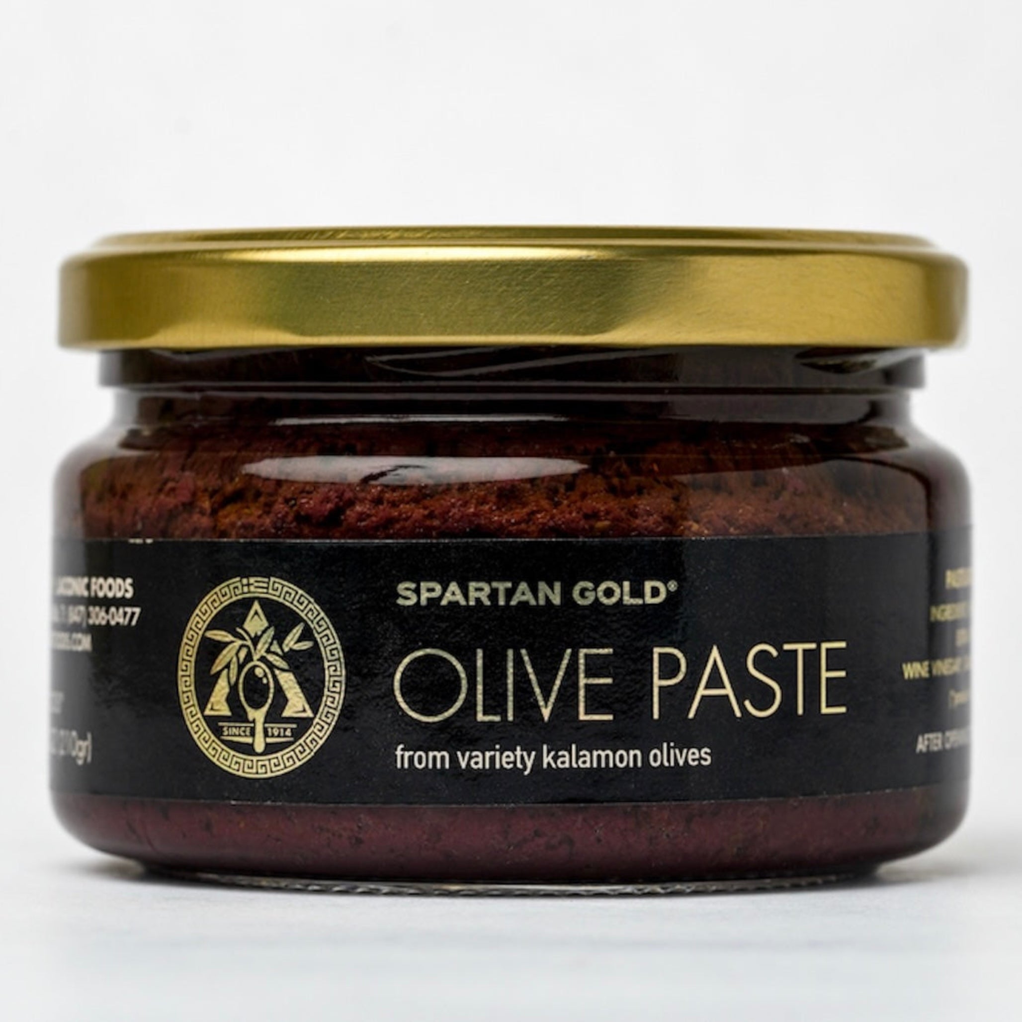 Glass jar of Kalamon olive paste with gold lid, made from Greek Kalamata olives by Laconic Foods.