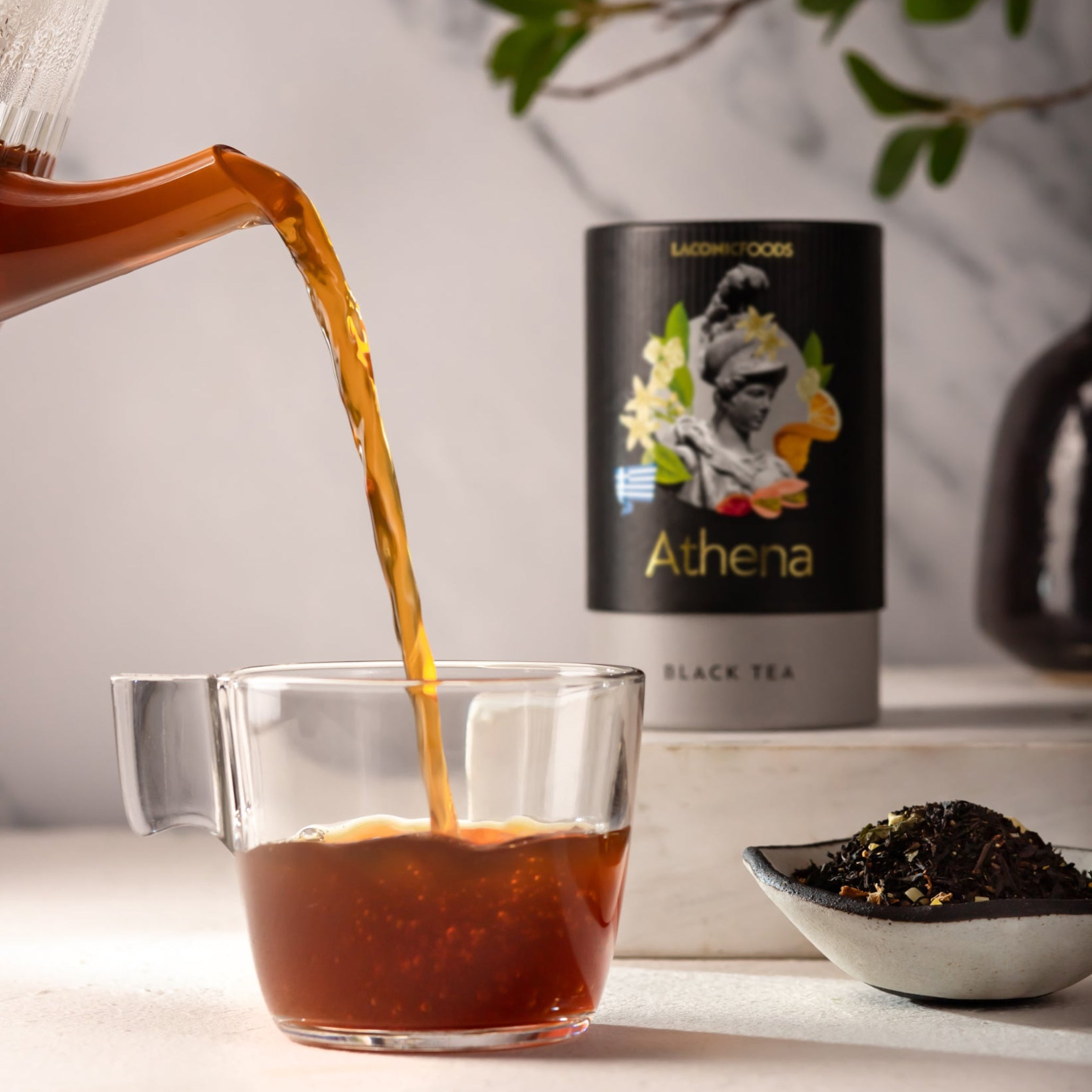 Laconic Foods Athena Black Tea poured into glass cup – rich amber infusion of premium Greek loose leaf black tea with citrus and floral notes.