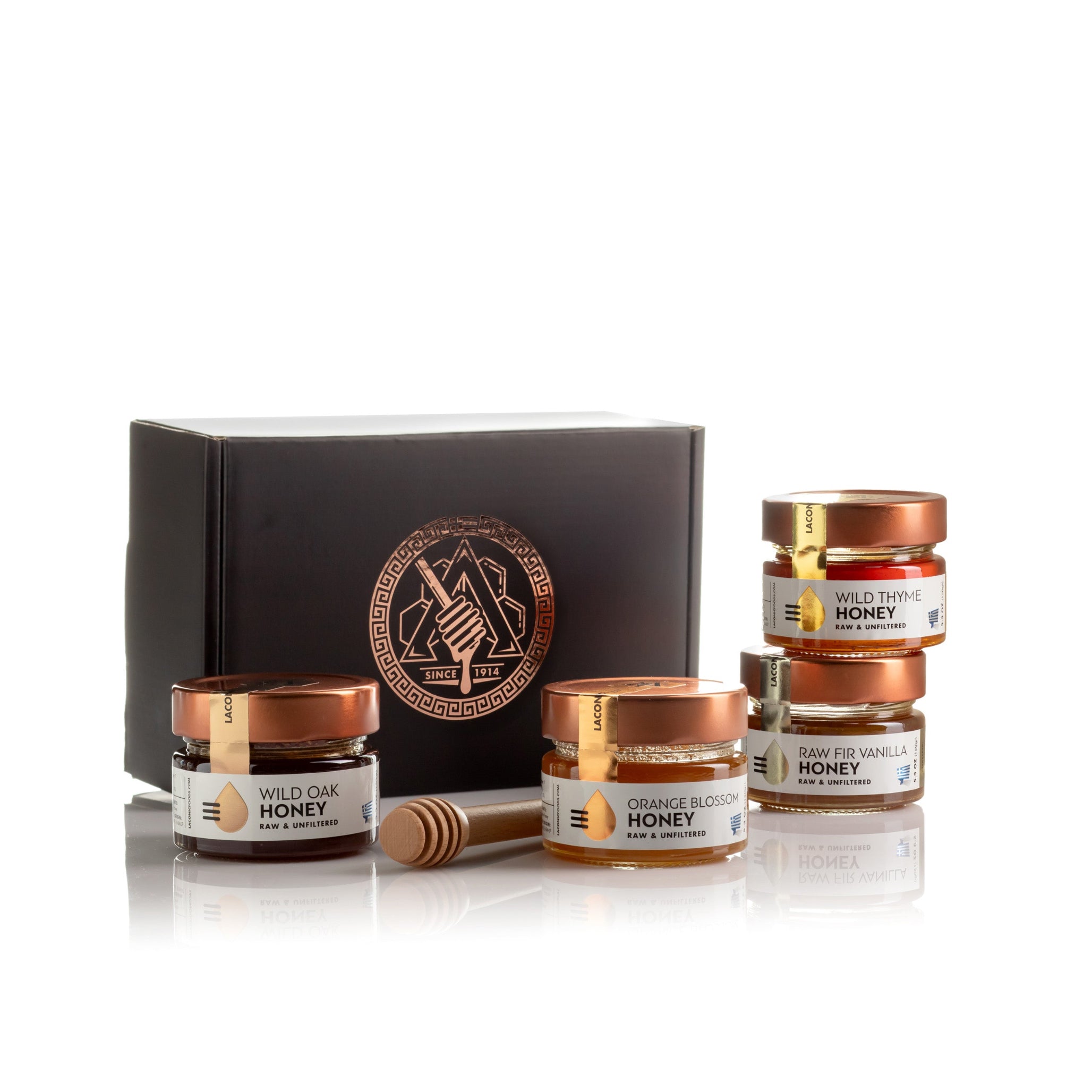 Laconic Foods Greek Honey 4-Pack Gift Set – Wild Oak, Orange Blossom, Raw Fir Vanilla, and Wild Thyme honey jars with premium black gift box.