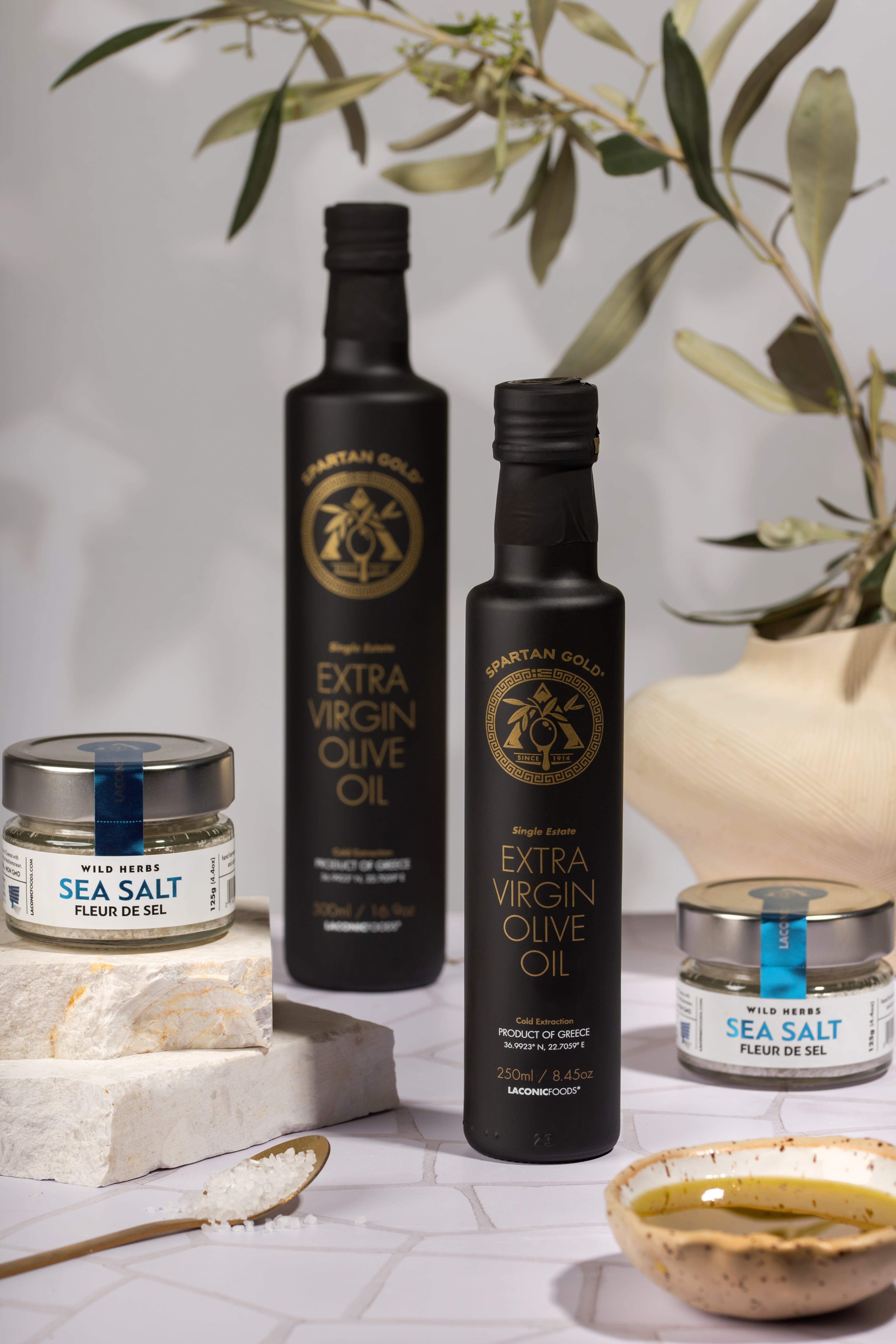Laconic Foods olive oil bottles with Fleur de Sel sea salt jars and ceramic dipping bowl