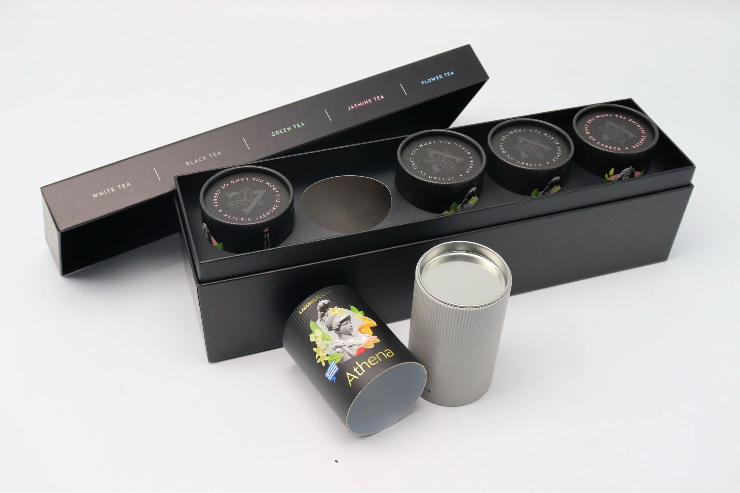 Athena black tea tube from Laconic Foods displayed in front of the Premium Greek Loose Leaf Tea Gift Set box.