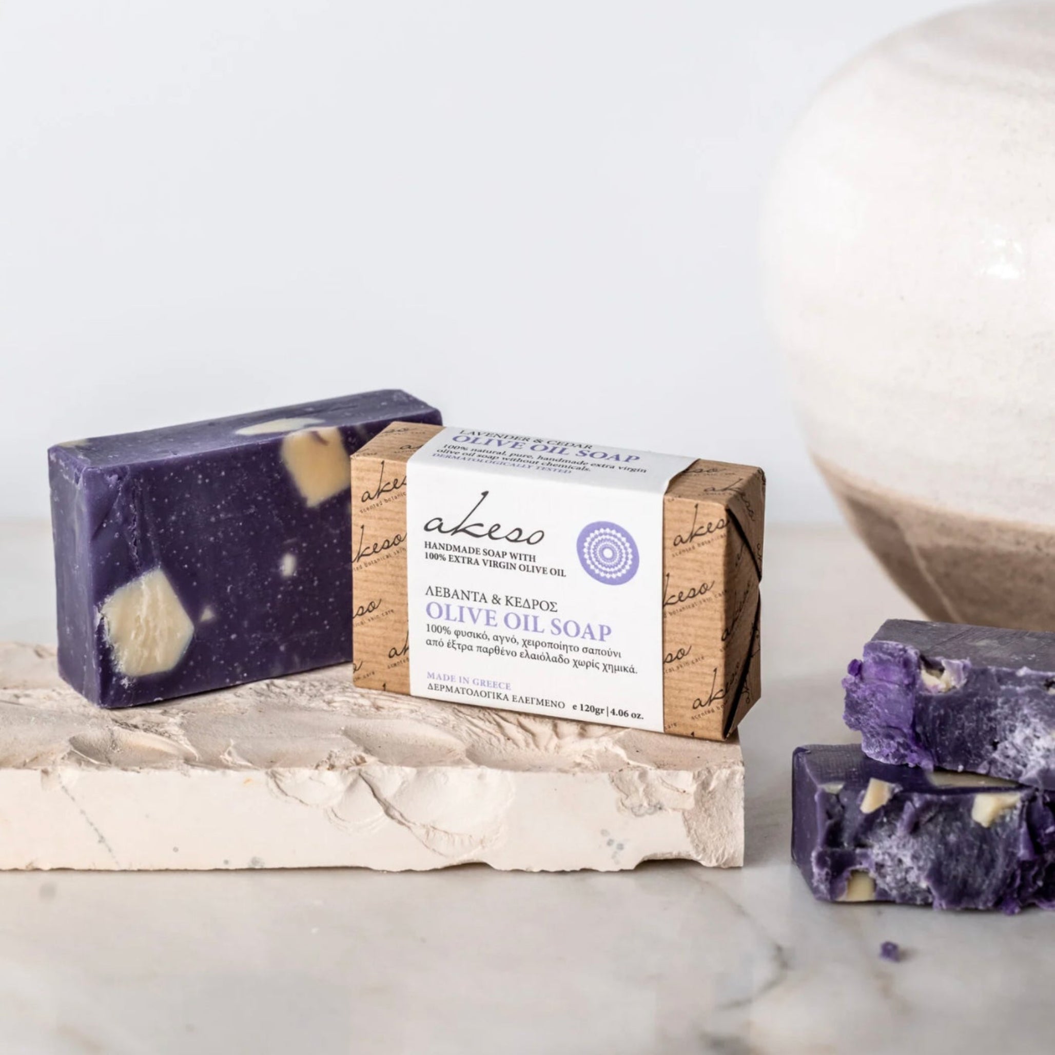 Handmade Greek lavender and cedar olive oil soap with packaged bar and purple soap pieces