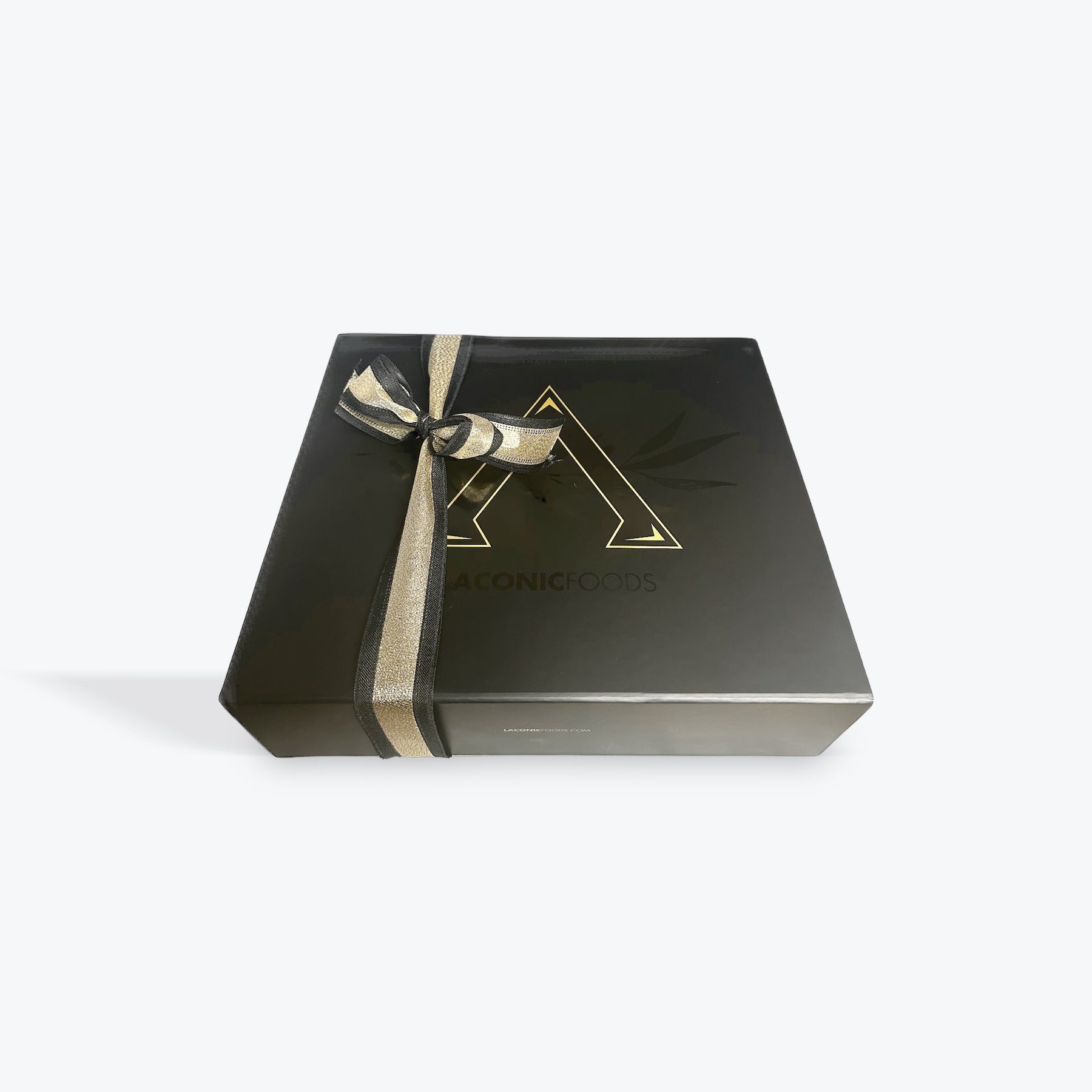Elegant black Laconic Foods gift box tied with gold ribbon – premium Greek gourmet presentation