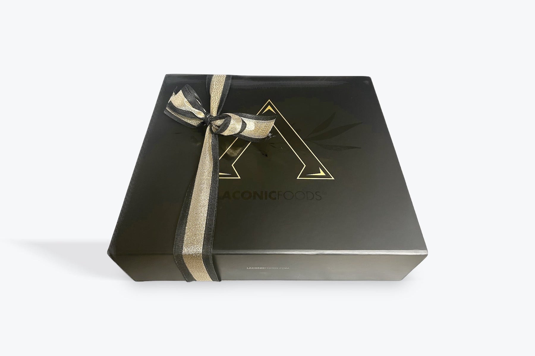 Premium Greek gift box by Laconic Foods with black and gold ribbon packaging — elegant presentation for gourmet Greek products