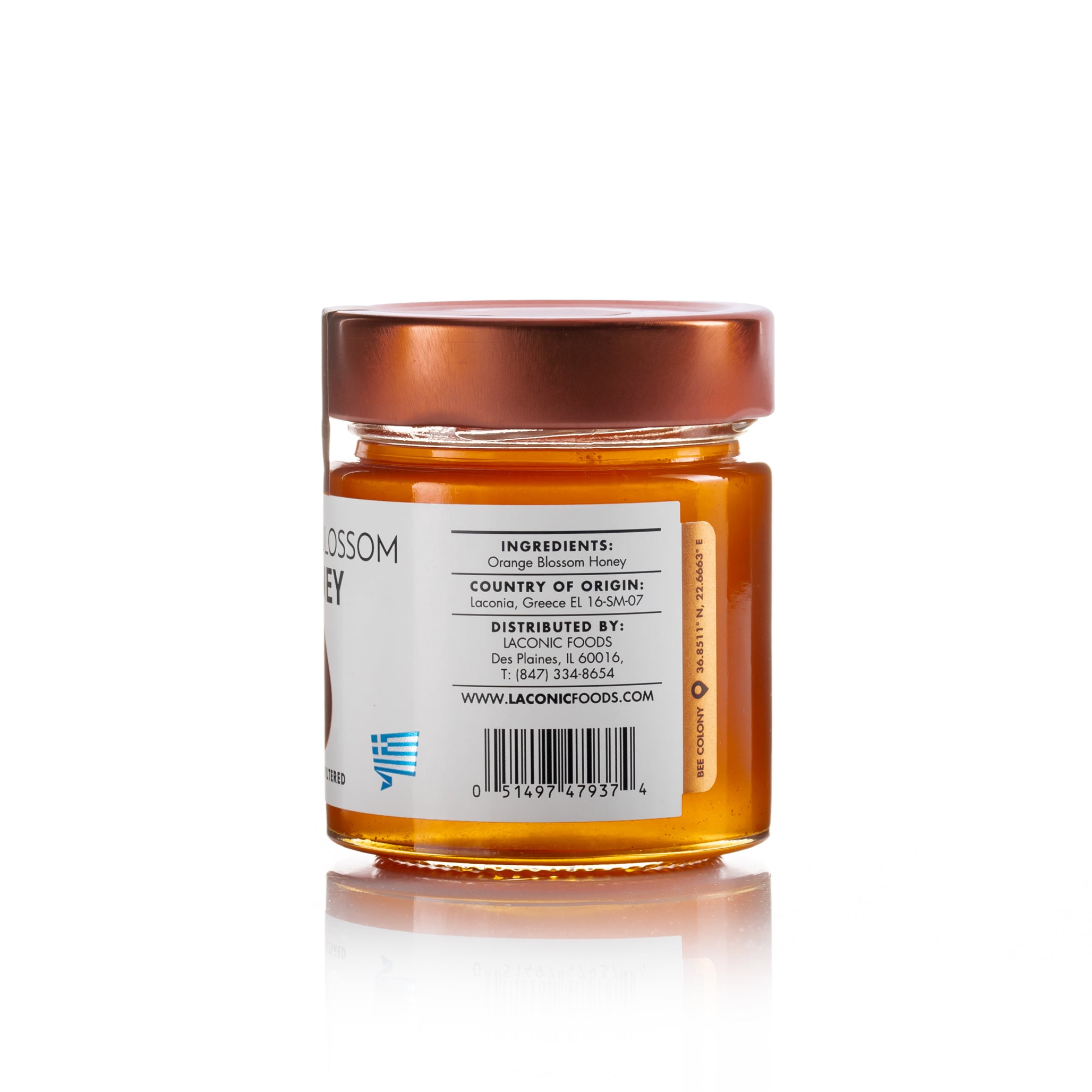Back view of Laconic Foods Orange Blossom Honey jar showing ingredients, origin from Laconia Greece, and distributor information.
