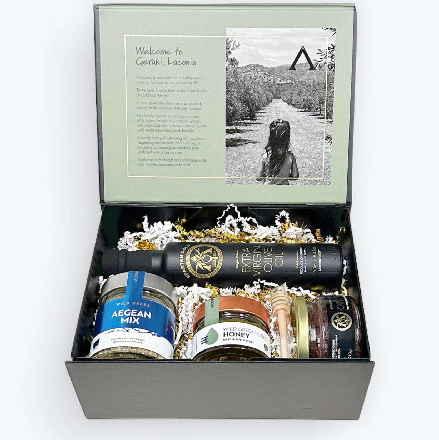 Premium Greek culinary gift box with Extra Virgin Olive Oil, Wild Forest Honey, Kalamata Olive Paste, Aegean Herb Mix, and wooden honey dipper
