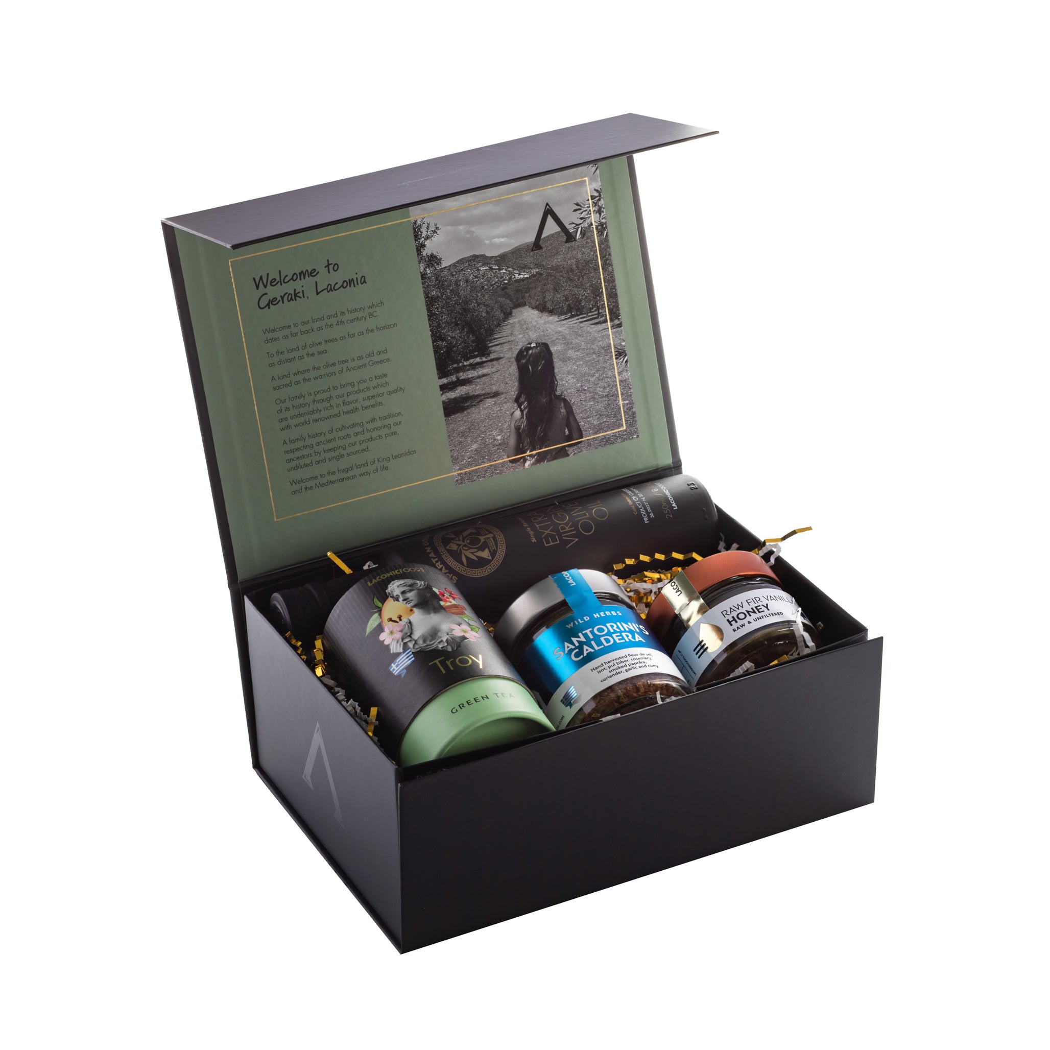 Festive Laconic Foods Greek holiday gift box featuring extra virgin olive oil, multiple Greek teas, raw honey jars, spice blends, and premium packaging
