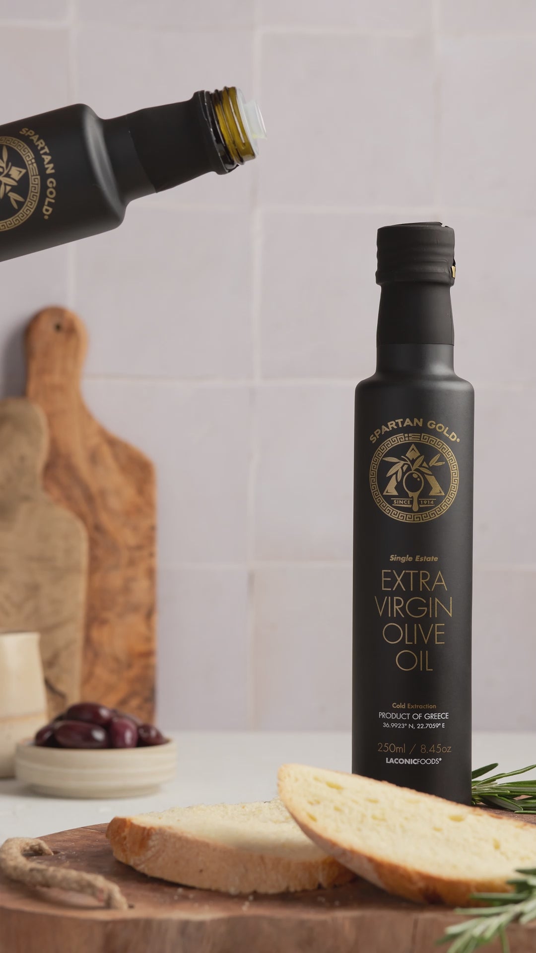 Video of Laconic Foods extra virgin olive oil being drizzled over warm rustic bread.