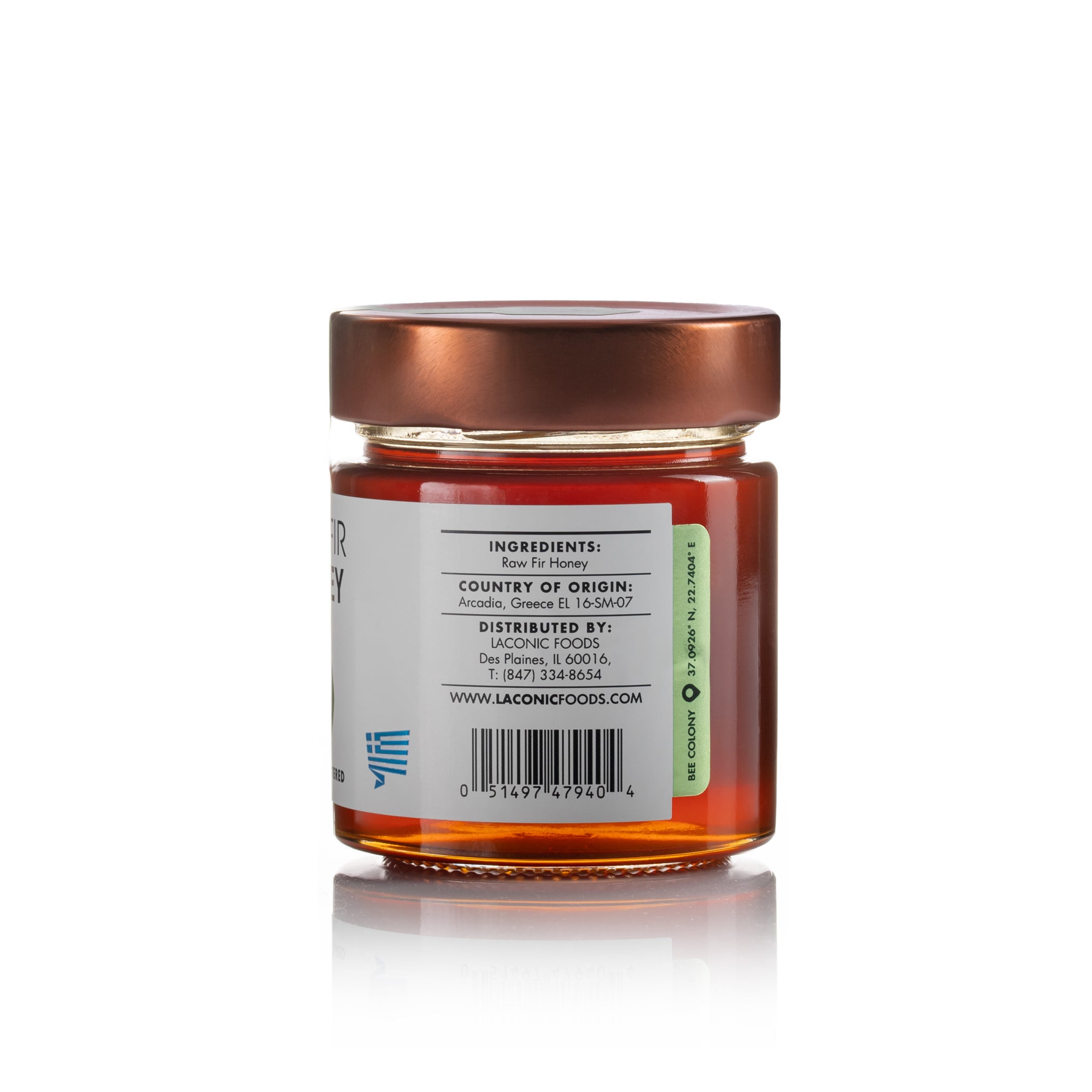 Back view of Laconic Foods Raw Fir Honey jar showing ingredients, origin from Arcadia Greece, and distributor information.