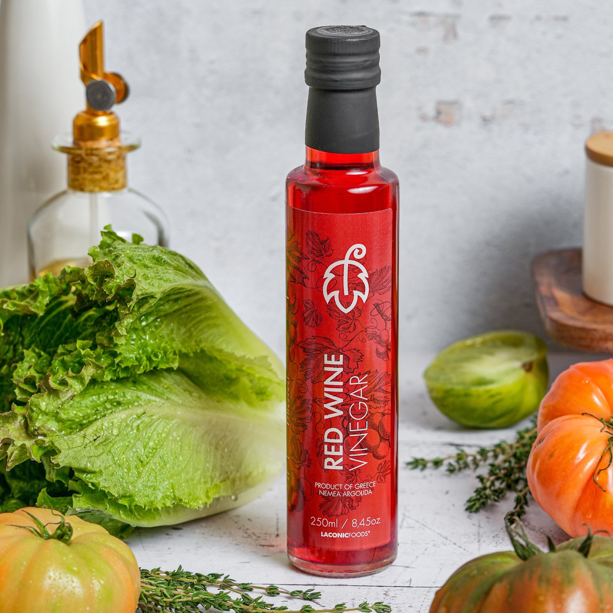 Greek red wine vinegar bottle with fresh vegetables lifestyle scene