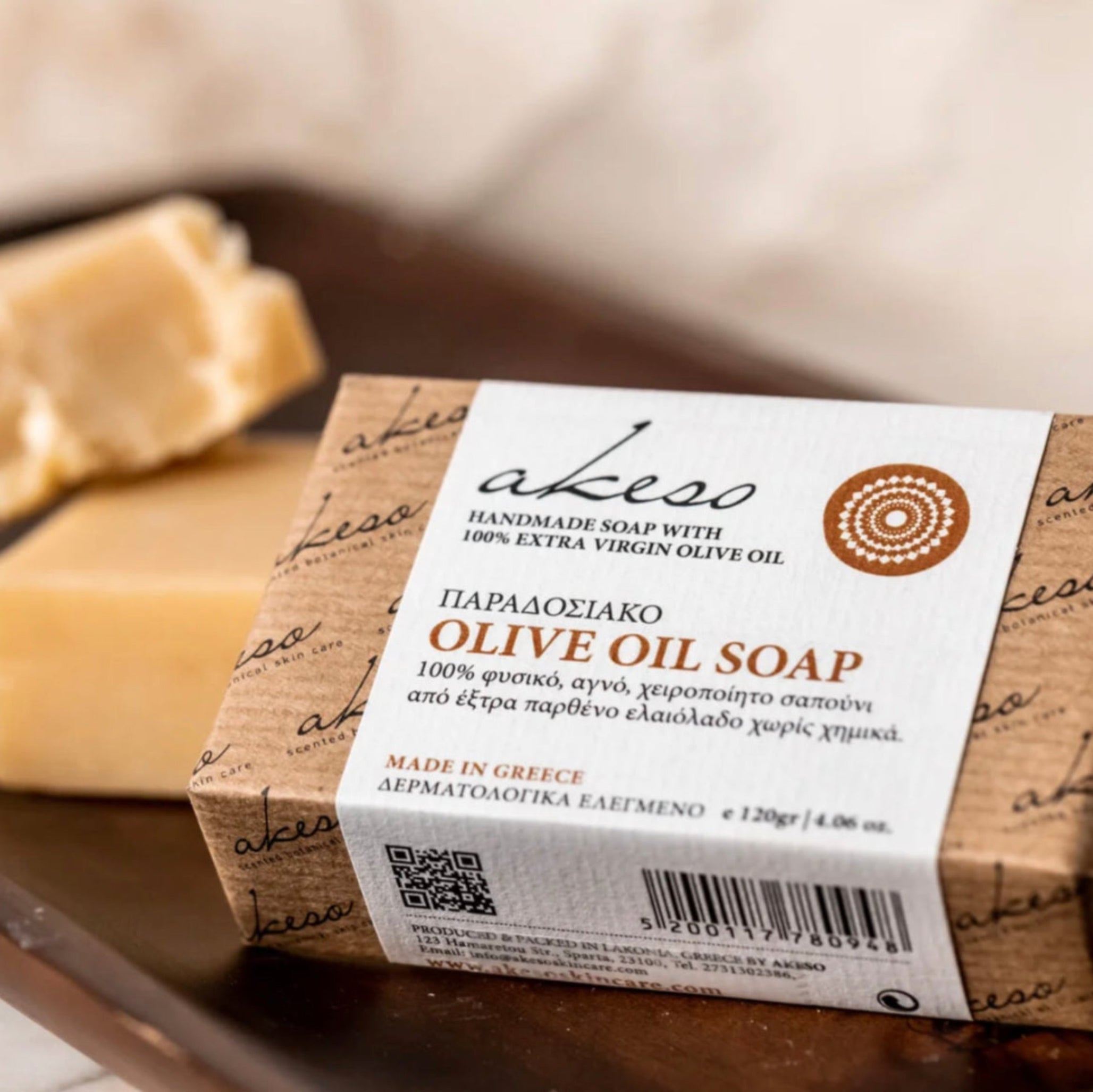 Traditional Greek olive oil soap displayed beside a handcrafted soap bar, made with extra virgin olive oil using traditional Mediterranean methods.